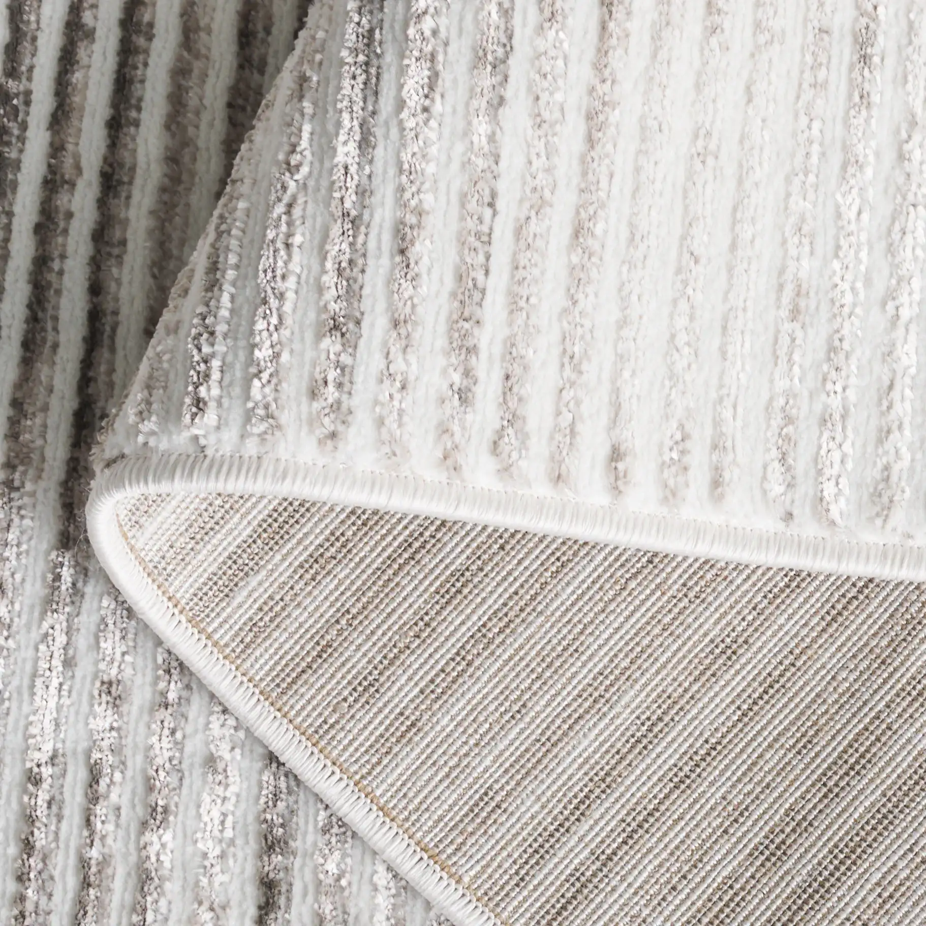 Orchard Ribbed Stripe Rug in Gray / Ivory in a styled room
