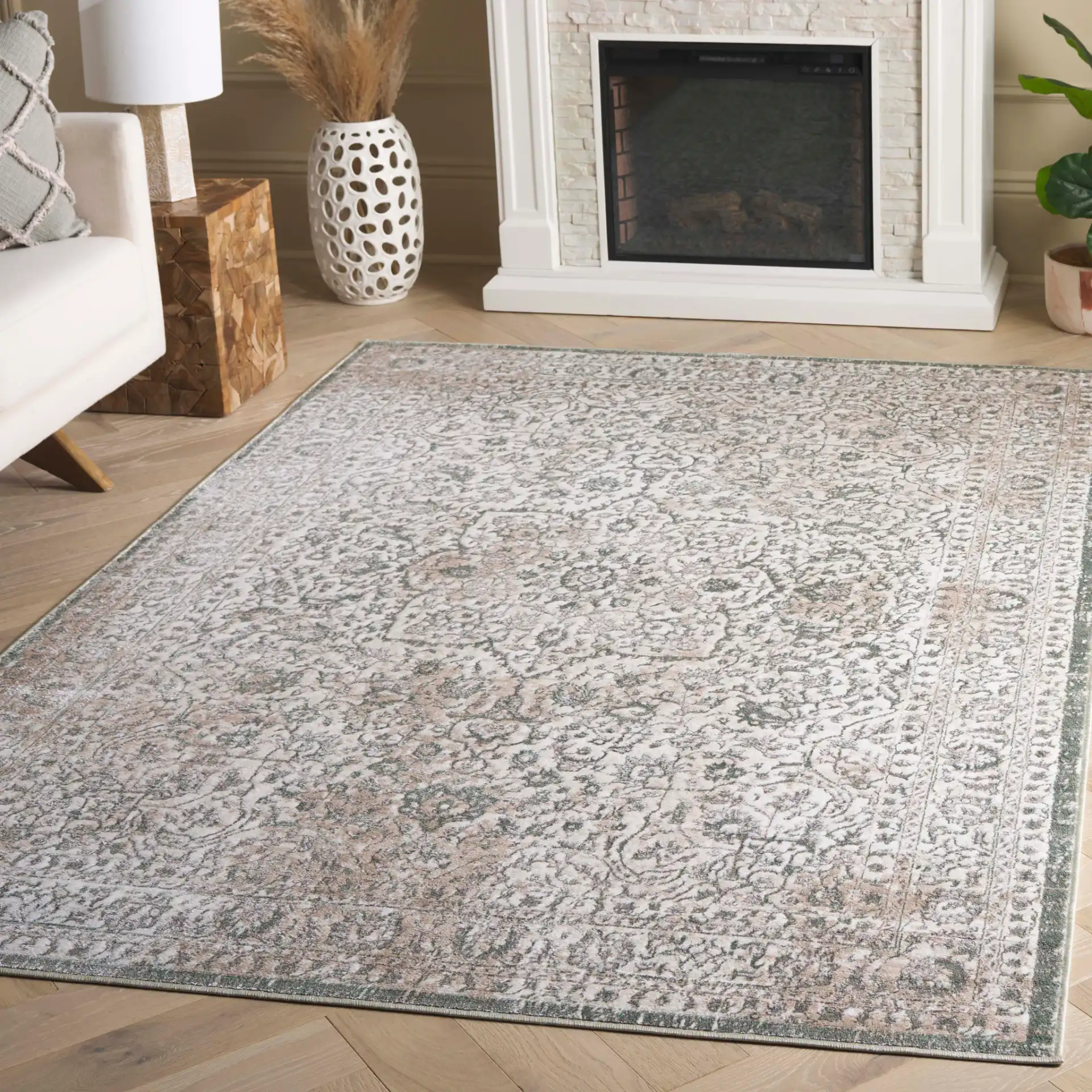 Orchard Medallion Bordered Rug in Green / Ivory in a styled room