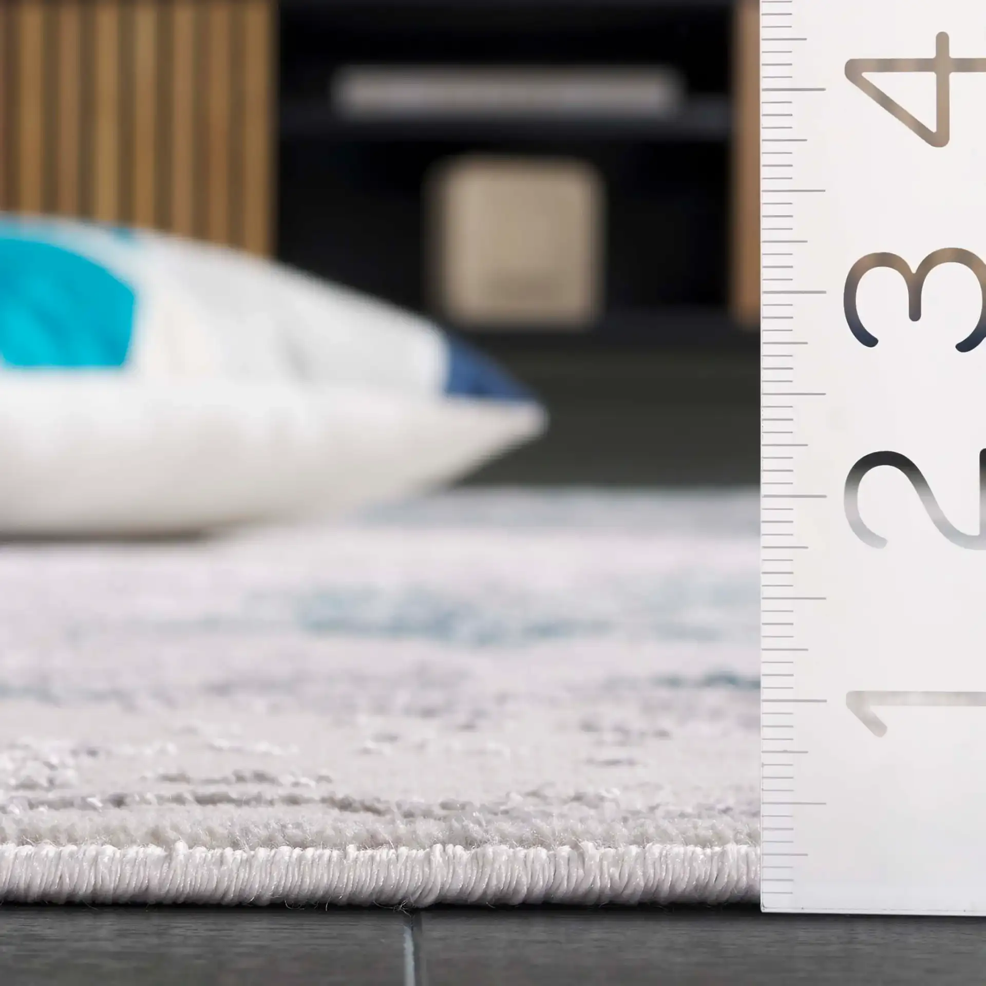 Orchard Abstract Rug in Gray / Blue in a styled room