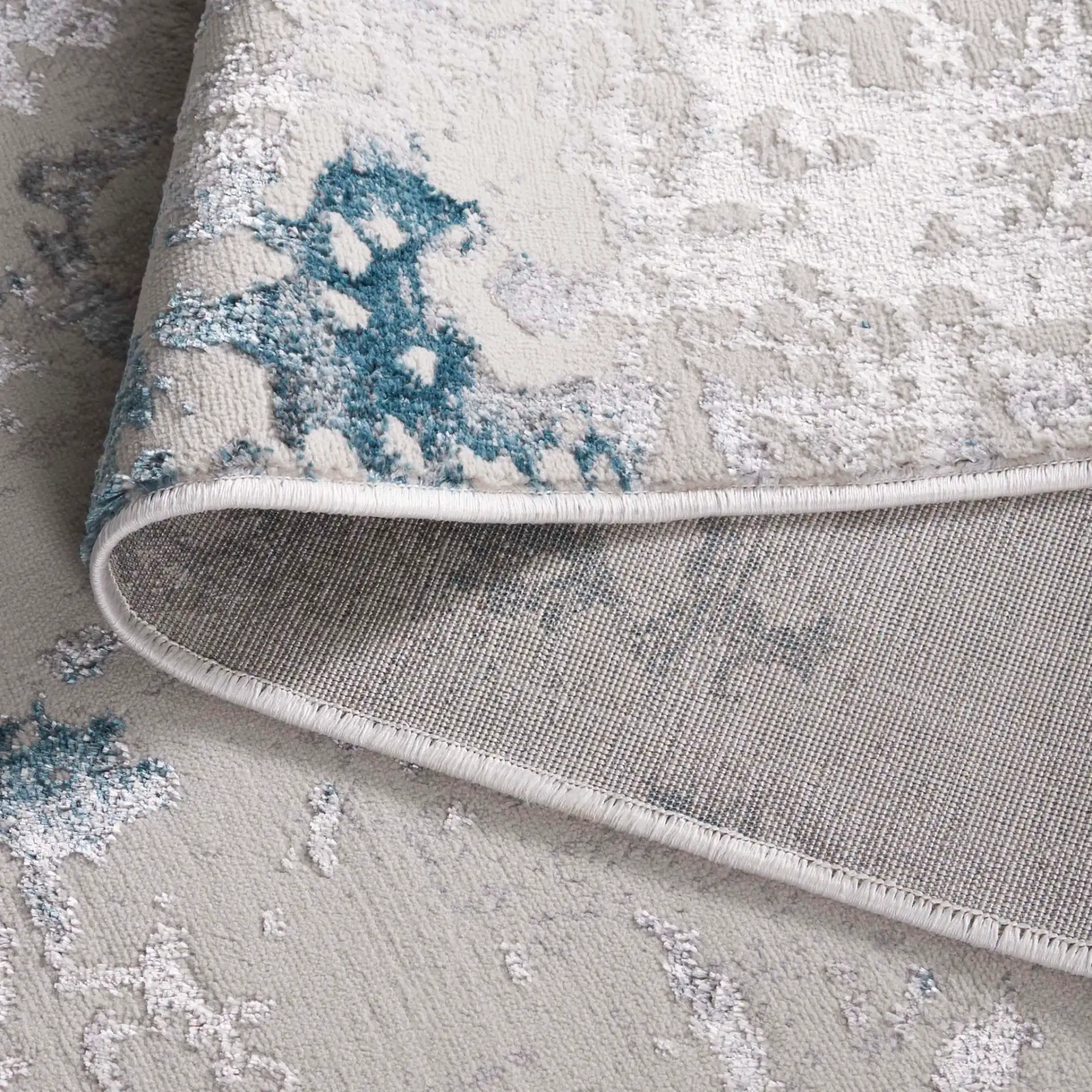 Orchard Abstract Rug in Gray / Blue in a styled room