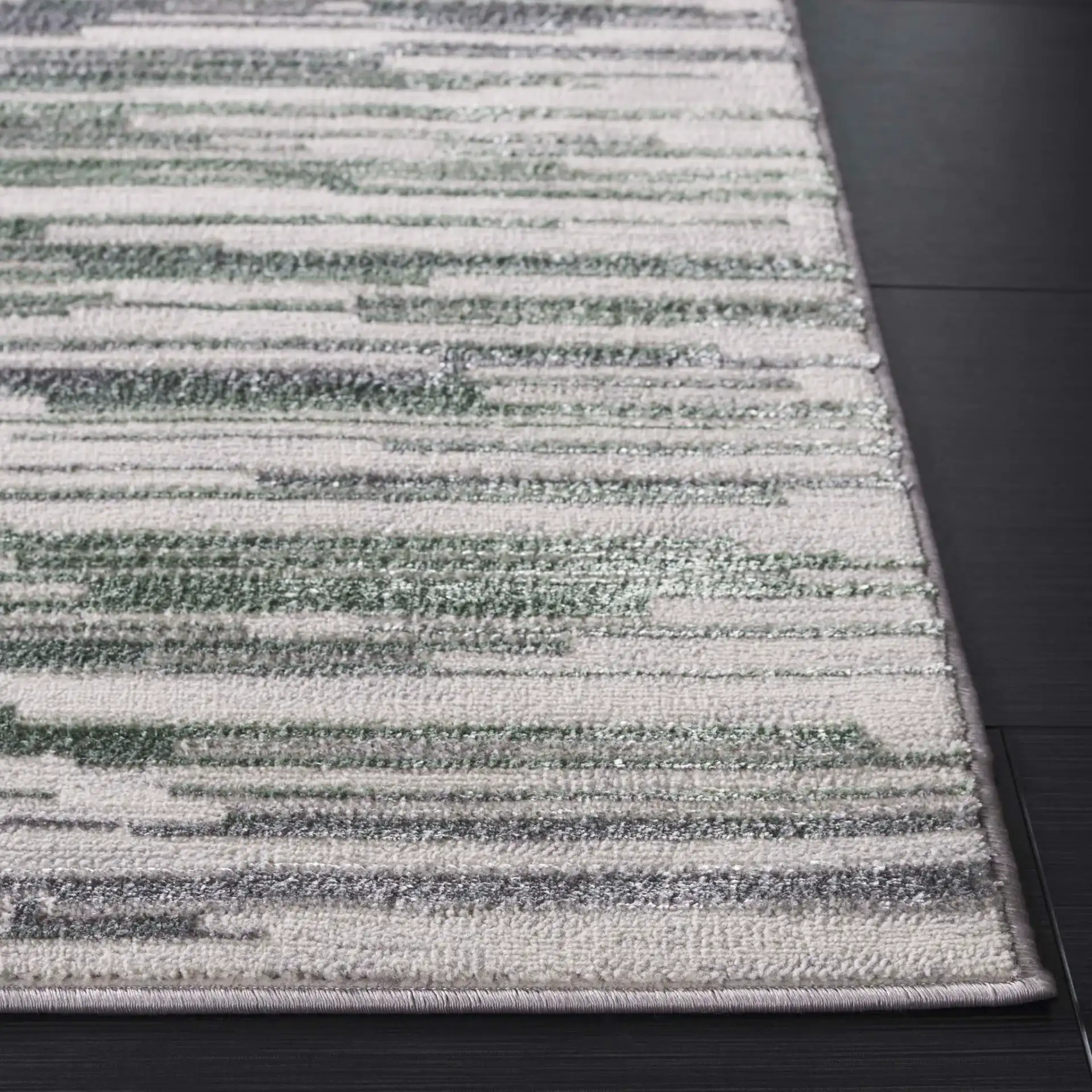Orchard Abstract Stripe Rug in Gray / Green in a styled room