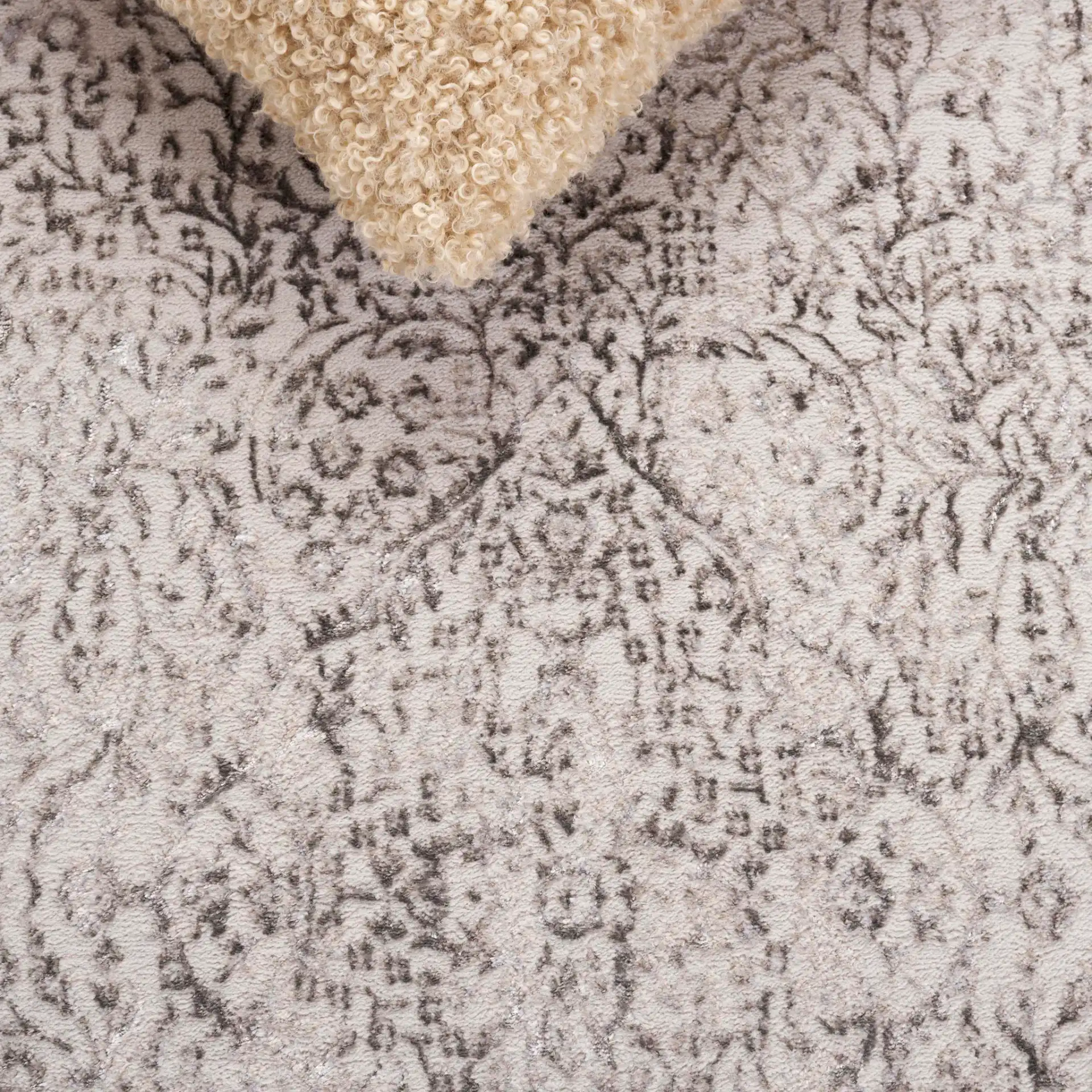 Orchard Vintage Floral Medallion Rug in Gray / Silver in a styled room
