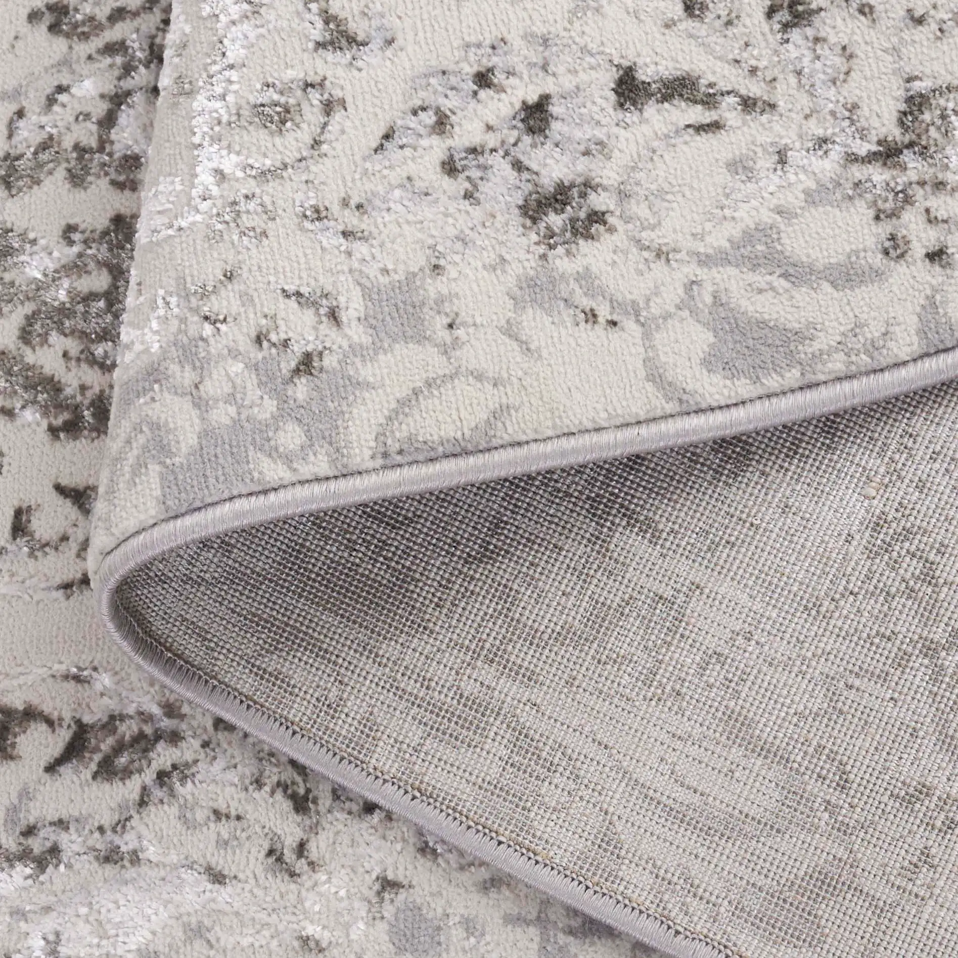 Orchard Distressed Damask Rug in Gray / Silver in a styled room