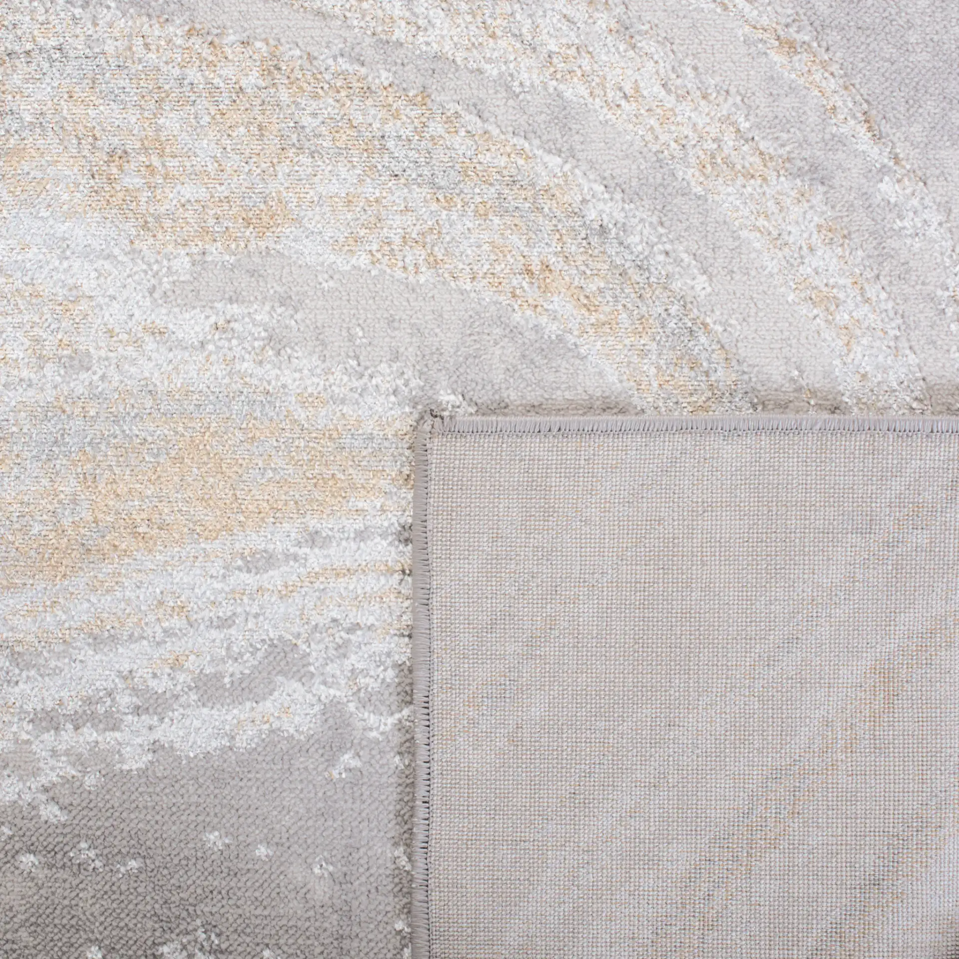 Orchard Swirl Abstract Rug in Gray / Gold in a styled room