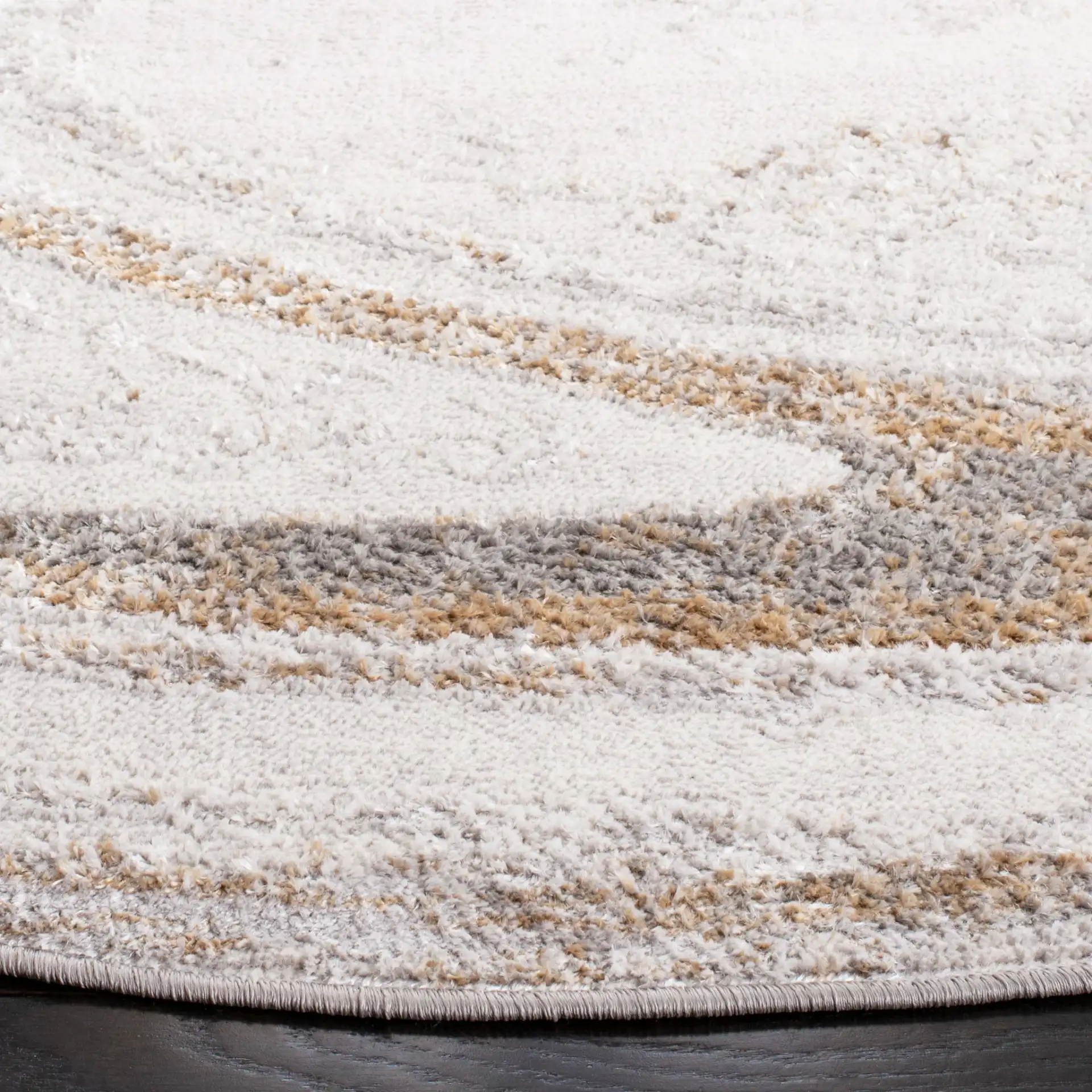 Orchard Swirl Abstract Rug in Gray / Gold in a styled room