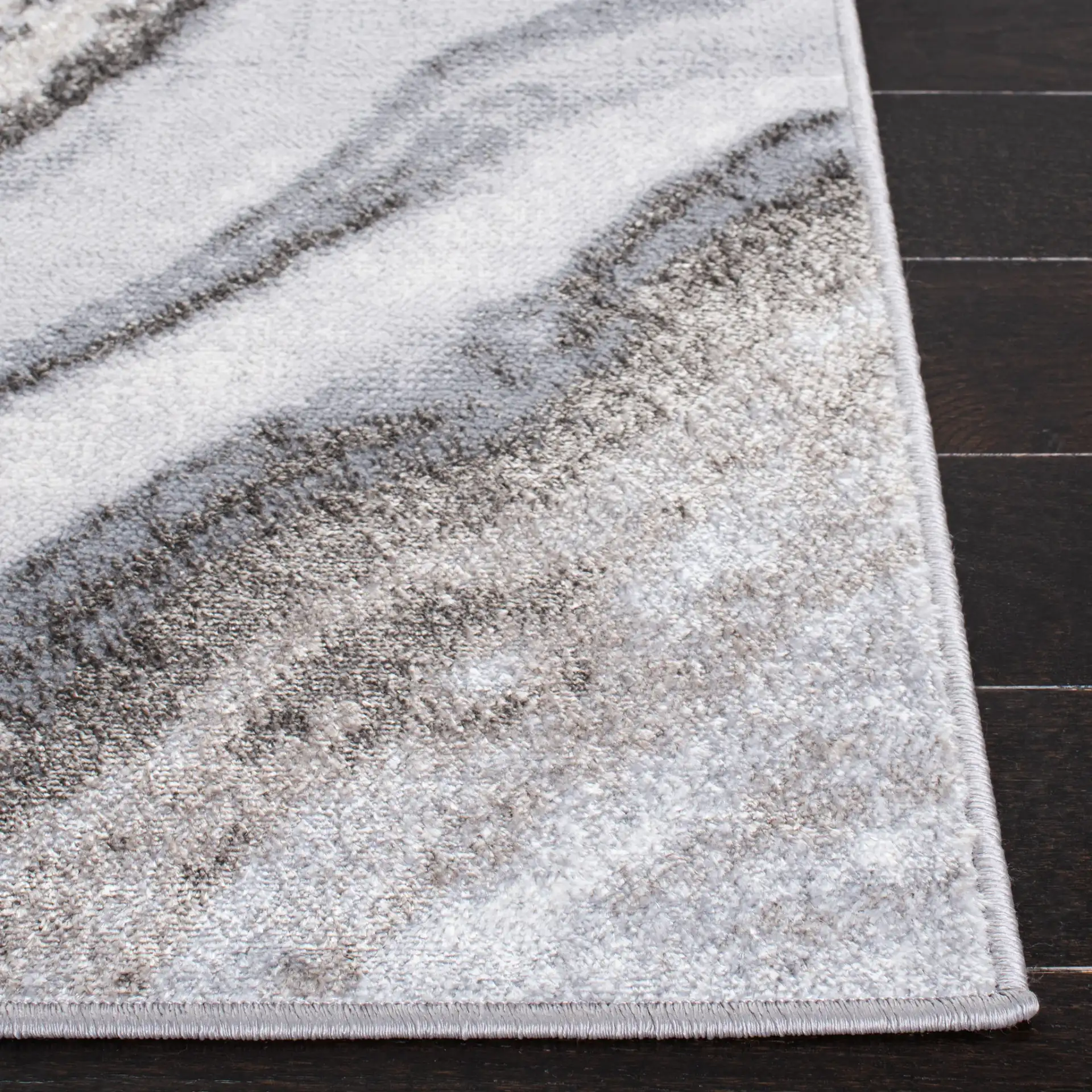 Orchard Marble Swirl Rug in Gray / Ivory in a styled room