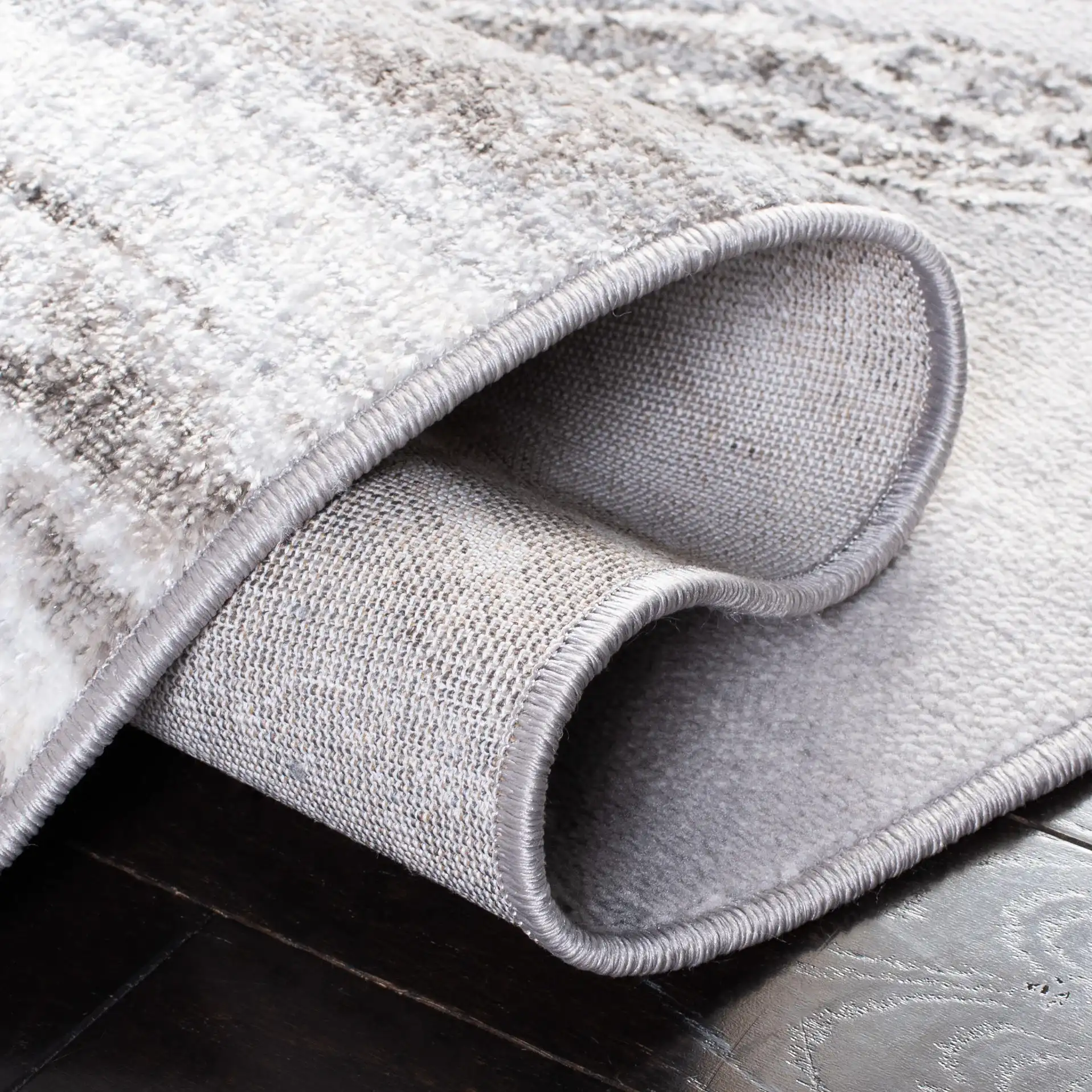 Orchard Marble Swirl Rug in Gray / Ivory in a styled room