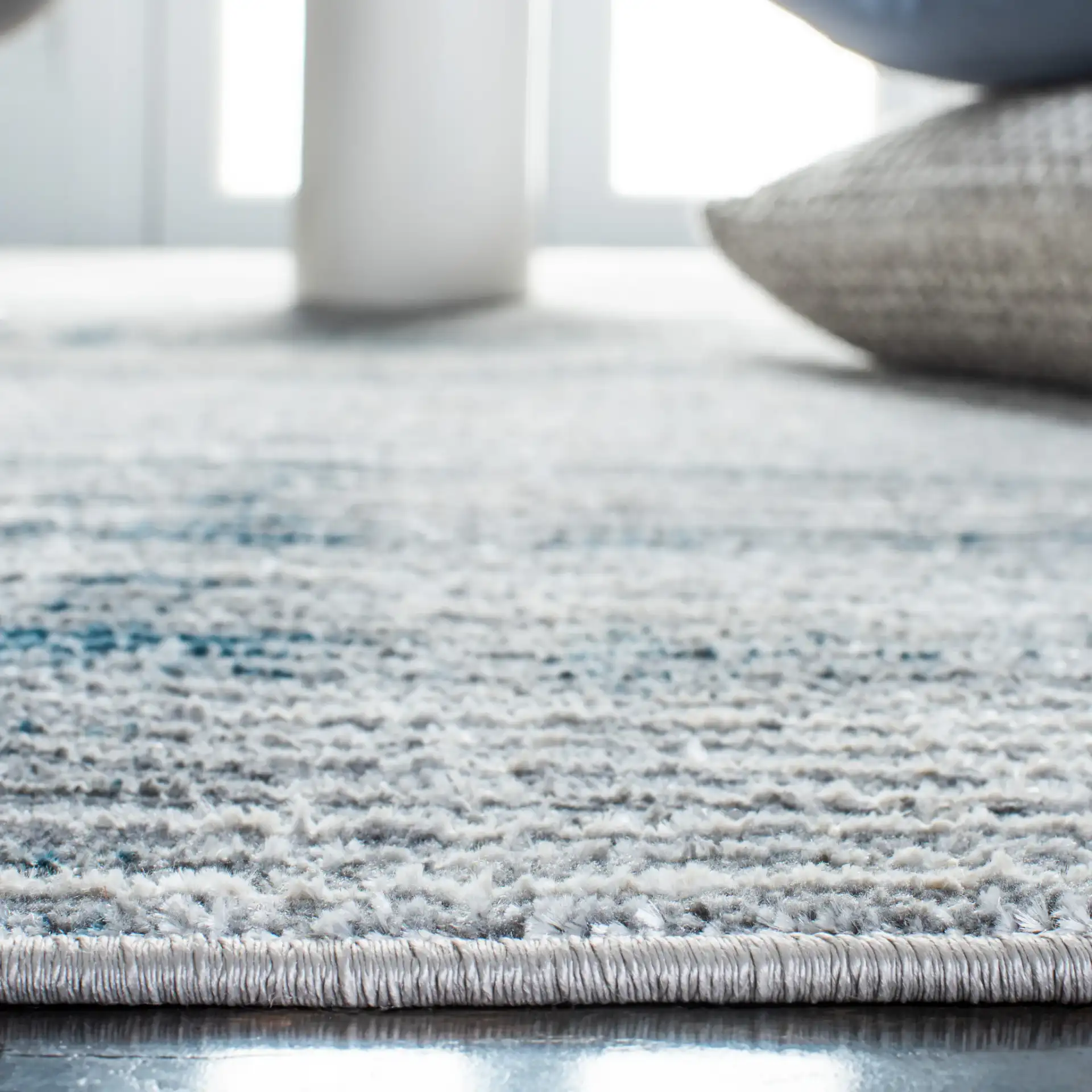 Orchard Distressed Stripe Rug in Gray / Blue in a styled room