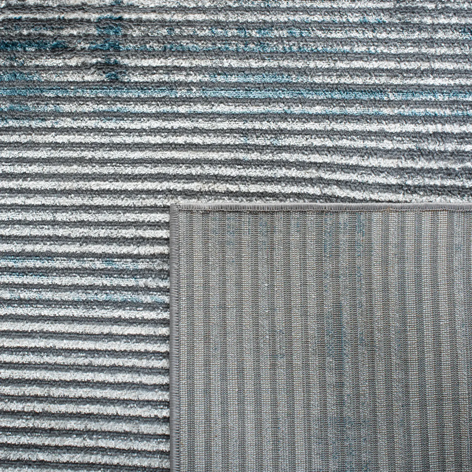 Orchard Distressed Stripe Rug in Gray / Blue in a styled room