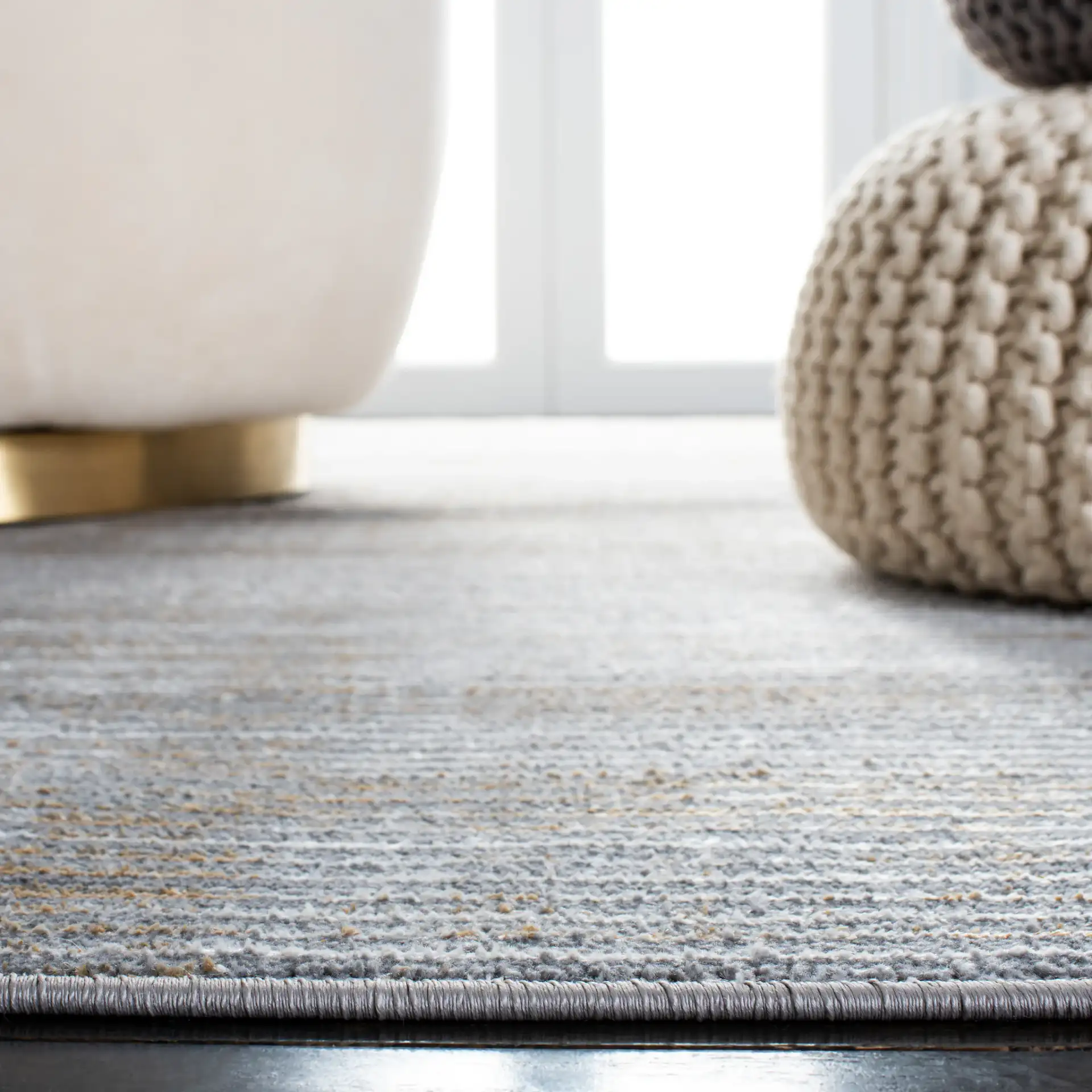 Orchard Distressed Stripe Rug in Gray / Gold in a styled room