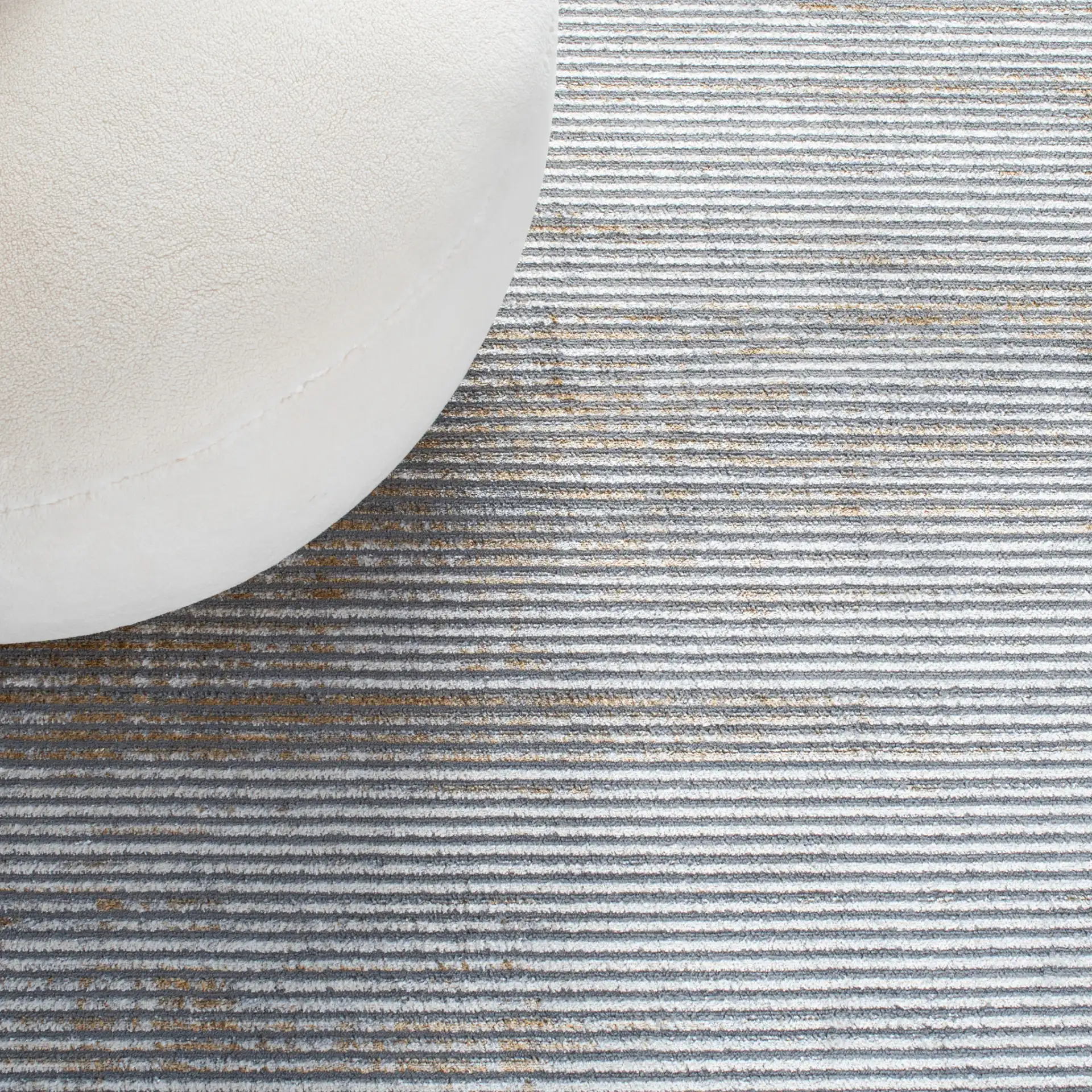 Orchard Distressed Stripe Rug in Gray / Gold in a styled room