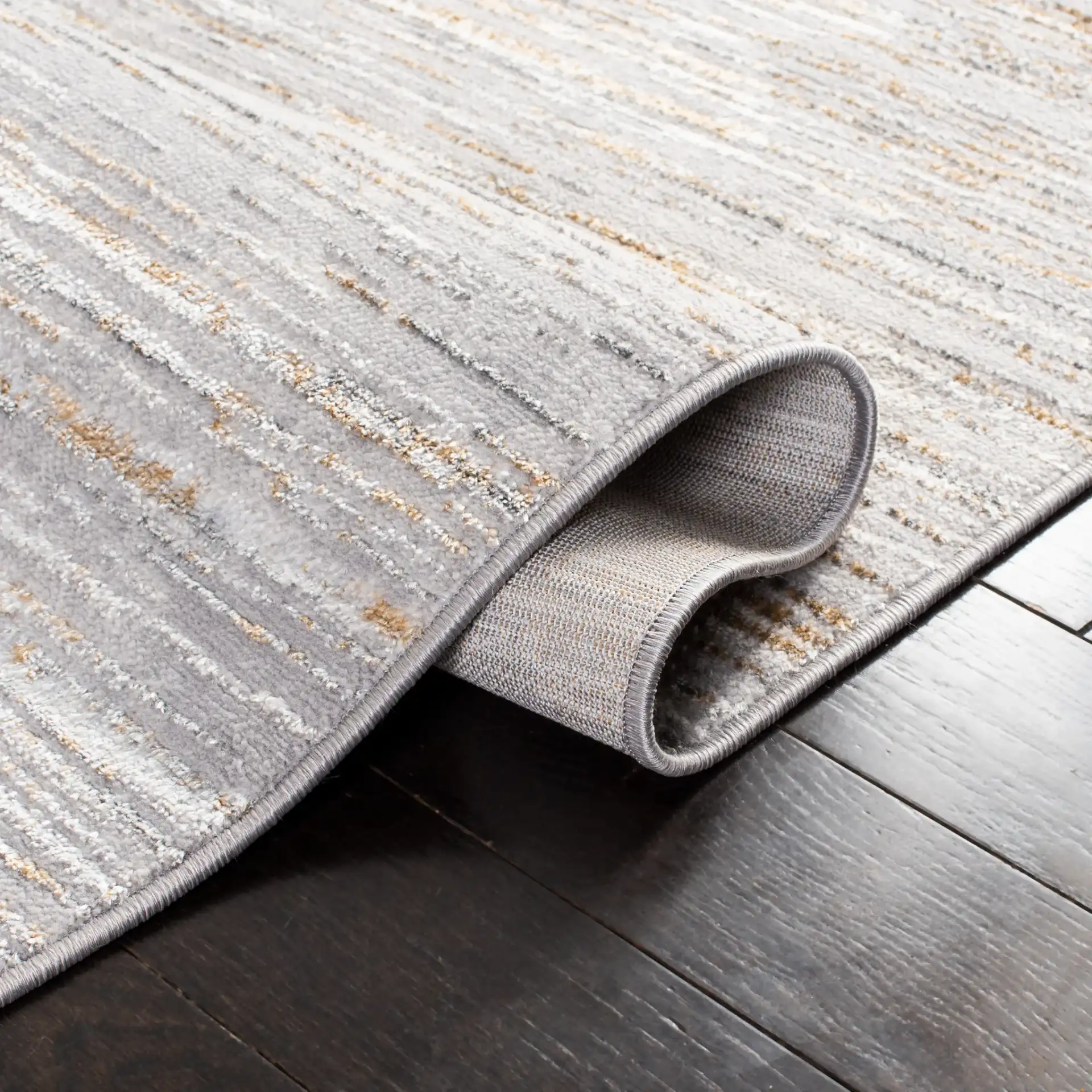 Orchard Linear Abstract Rug in Gray / Gold in a styled room