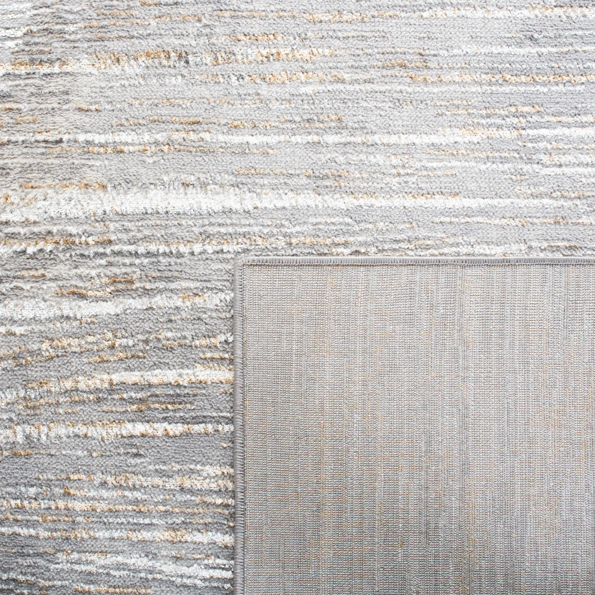 Orchard Linear Abstract Rug in Gray / Gold in a styled room