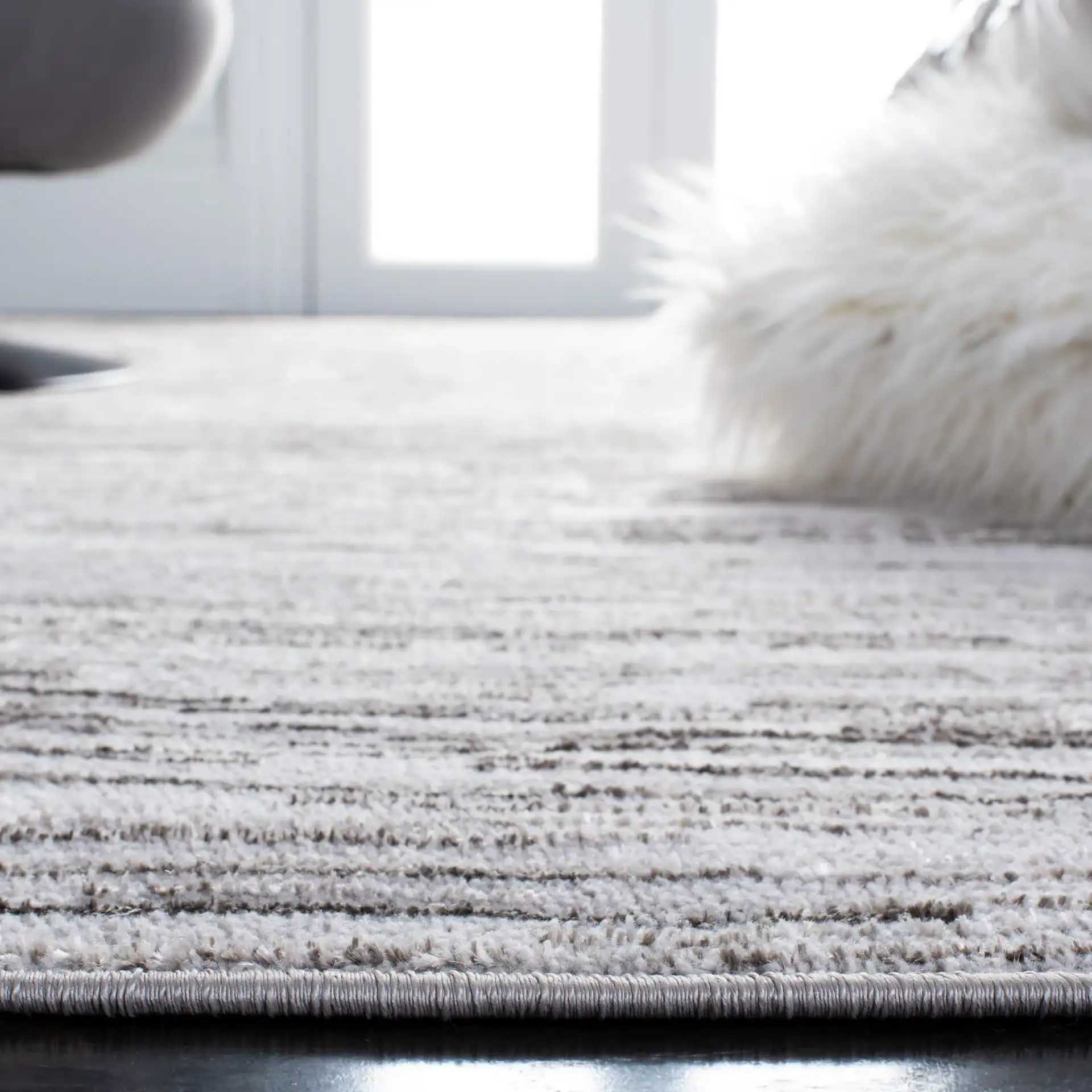 Orchard Linear Abstract Rug in Gray / Light Gray in a styled room