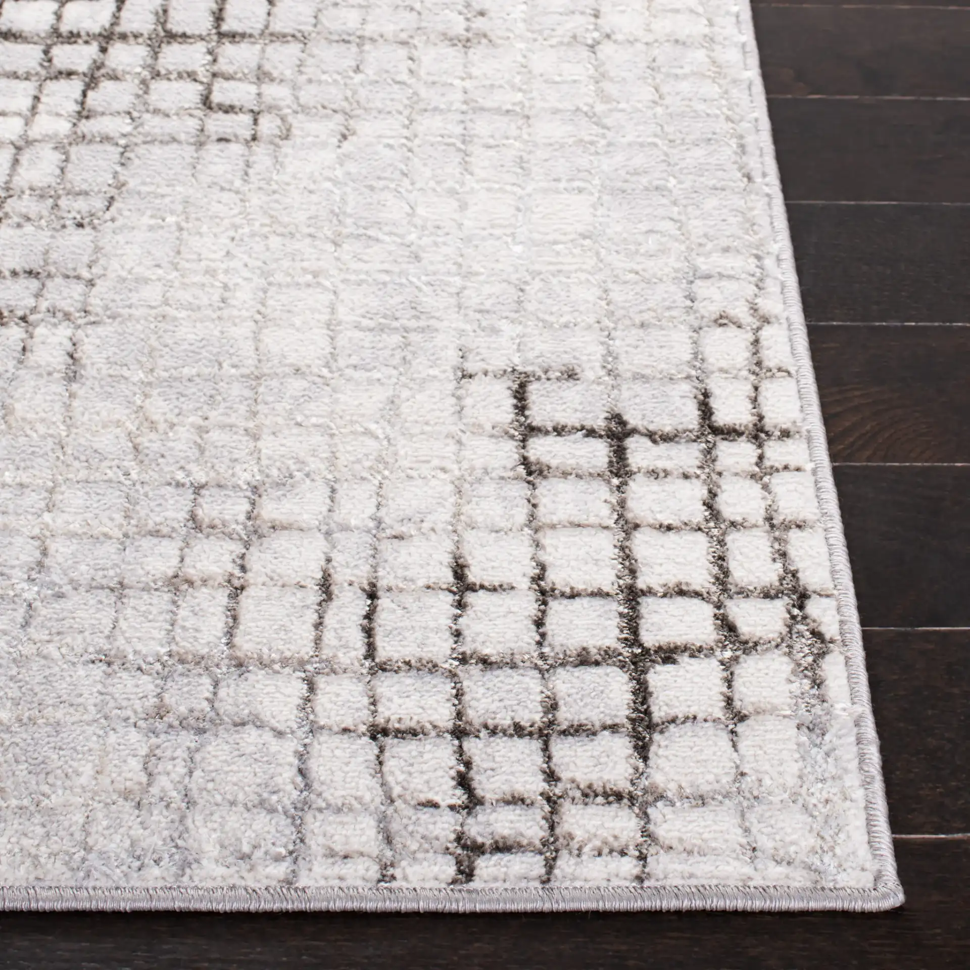 Orchard Abstract Grid Rug in Gray / Light Gray in a styled room