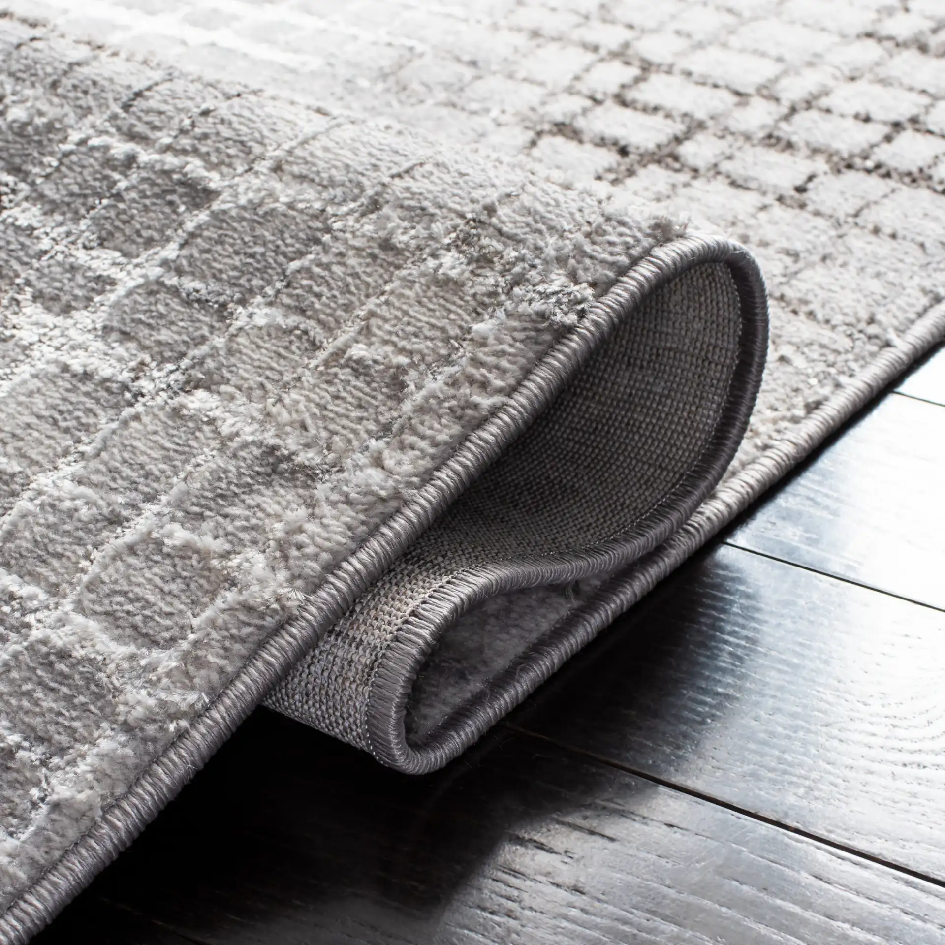 Orchard Abstract Grid Rug in Gray / Light Gray in a styled room