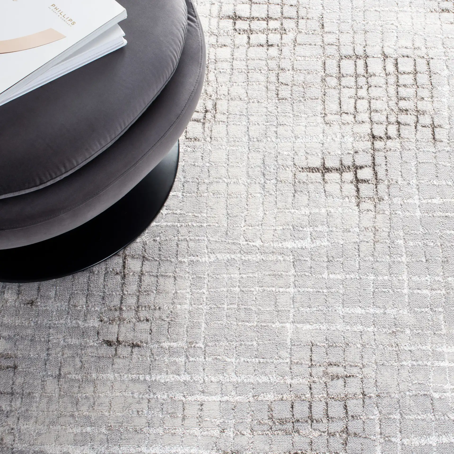 Orchard Abstract Grid Rug in Gray / Light Gray in a styled room