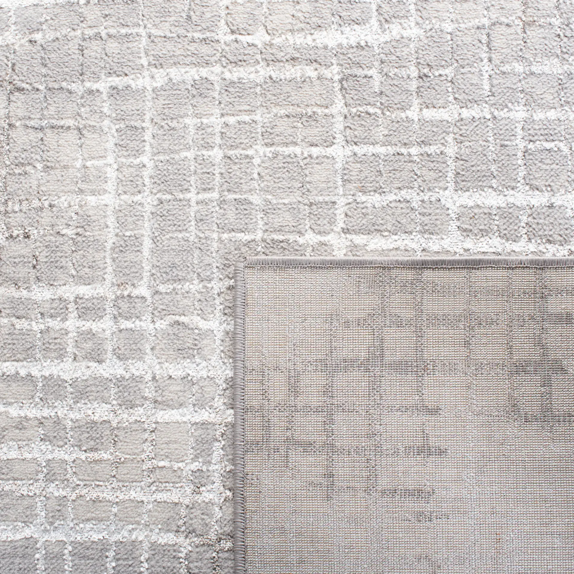 Orchard Abstract Grid Rug in Gray / Light Gray in a styled room