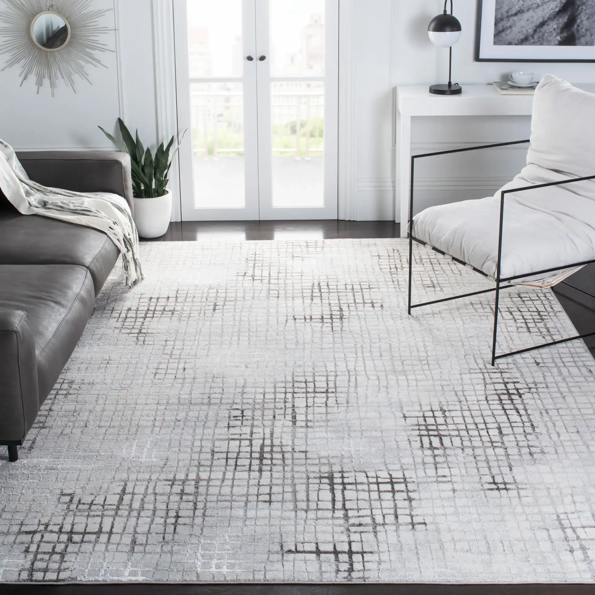 Orchard Abstract Grid Rug in Gray / Light Gray in a styled room