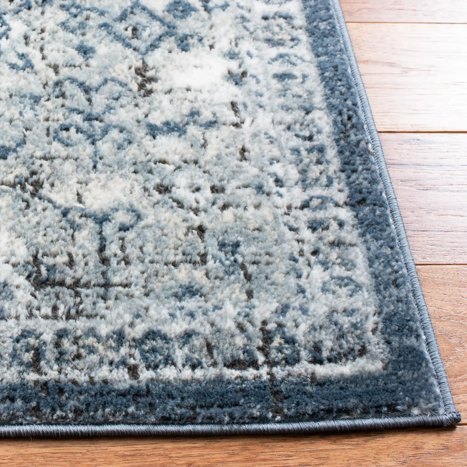 Oregon Faded Medallion Rug in Navy / Ivory in a styled room