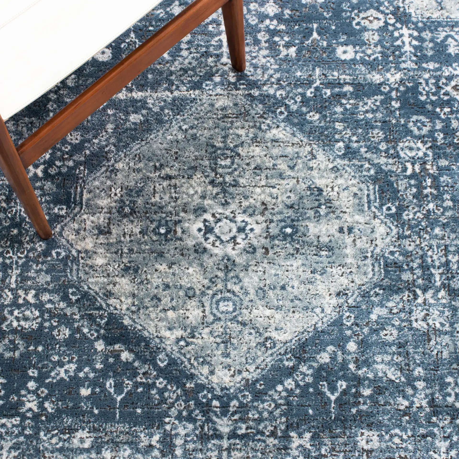 Oregon Faded Medallion Rug in Navy / Ivory in a styled room