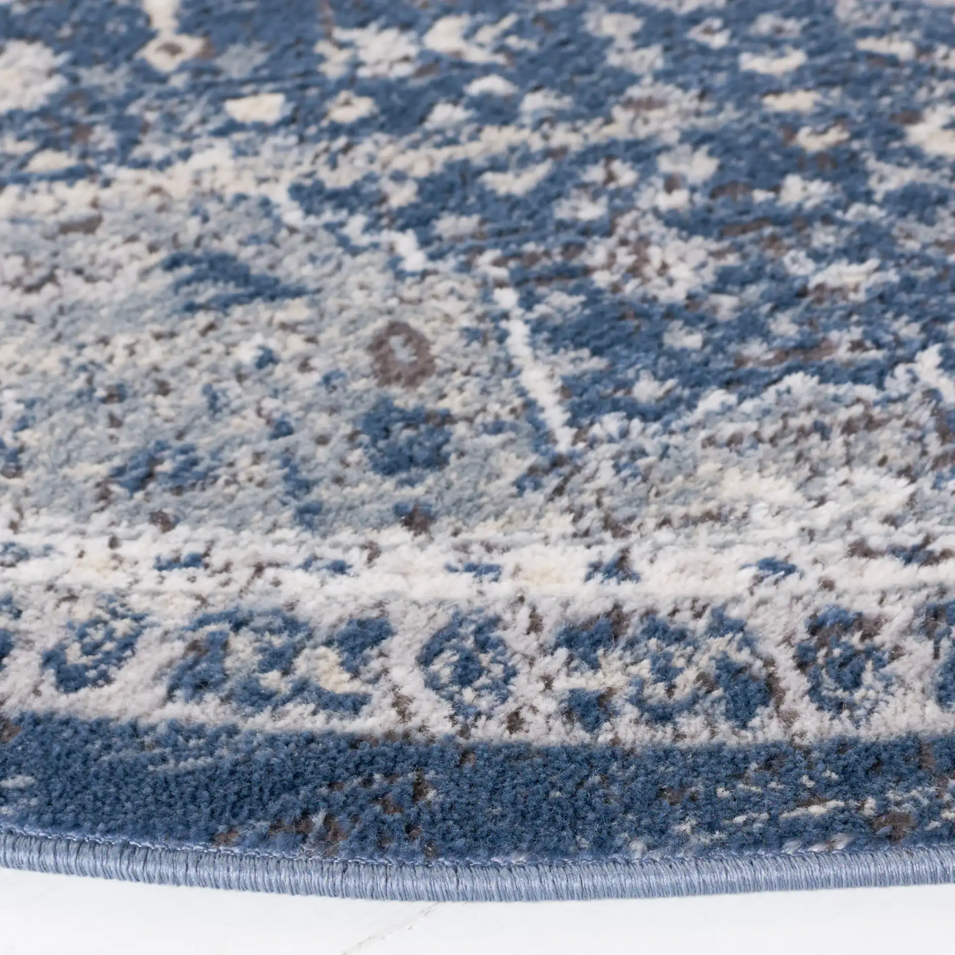 Oregon Faded Medallion Rug in Navy / Ivory in a styled room