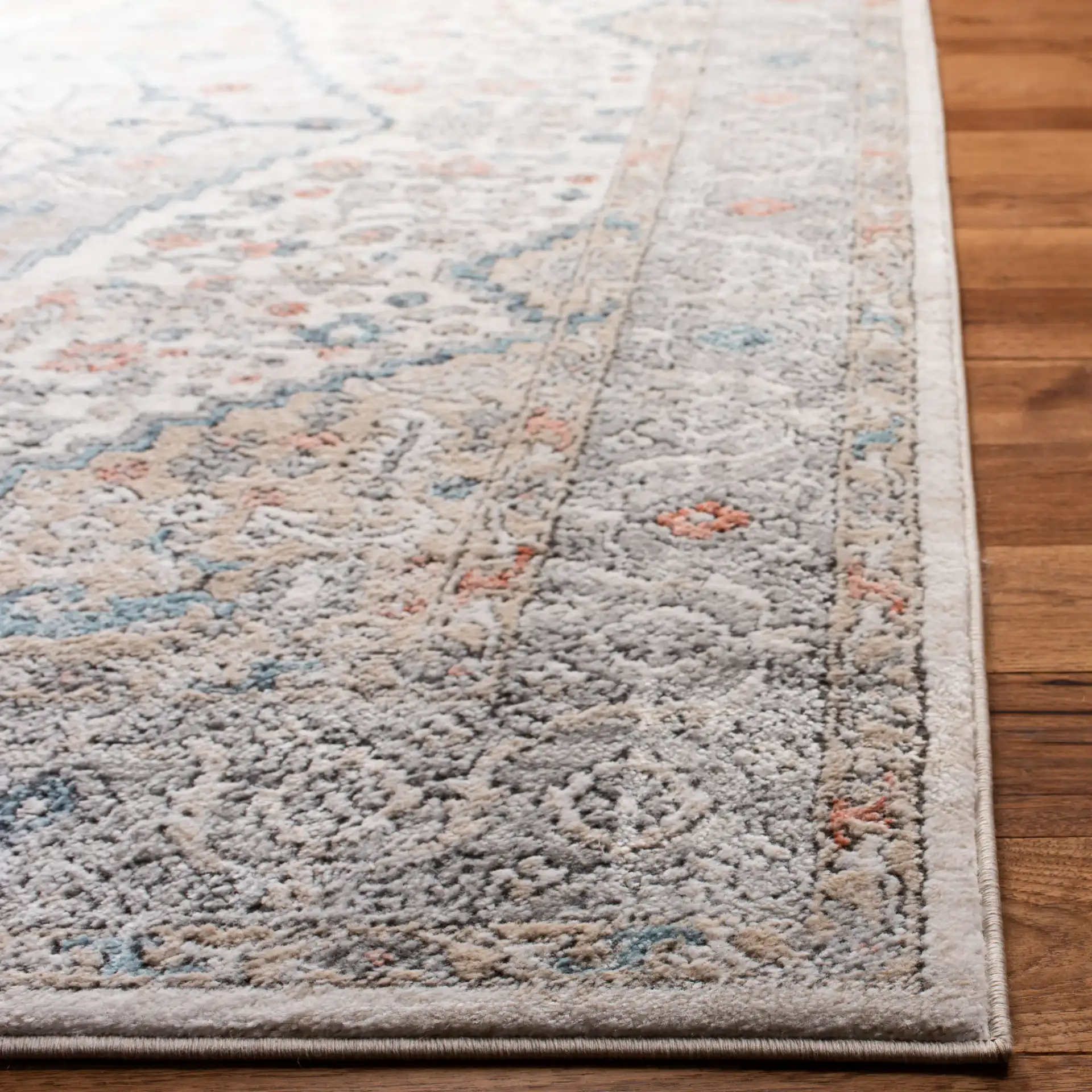 Oregon Diamond Medallion Rug in Gray / Ivory in a styled room