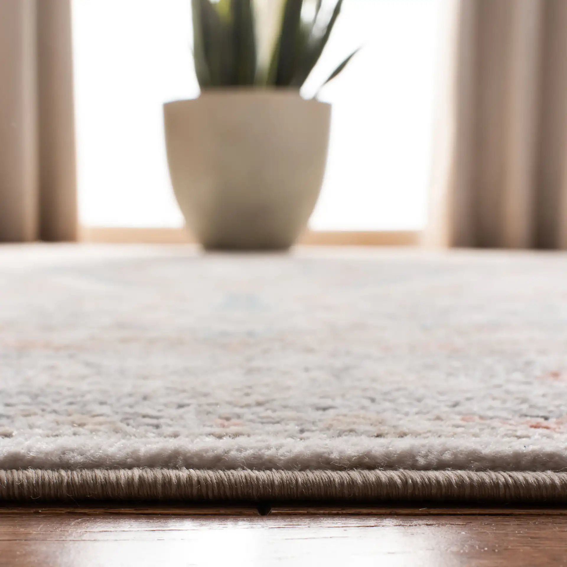 Oregon Diamond Medallion Rug in Gray / Ivory in a styled room