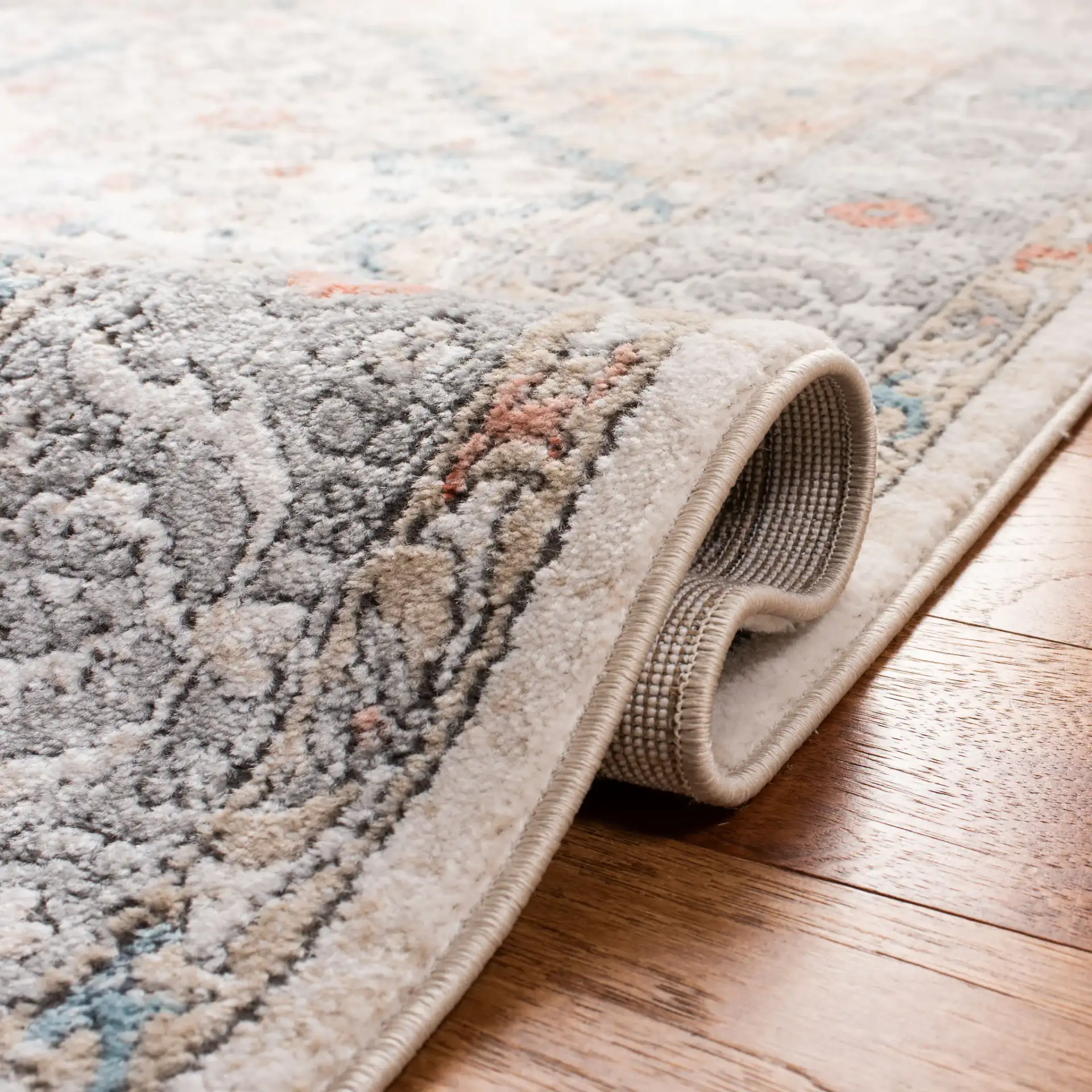 Oregon Diamond Medallion Rug in Gray / Ivory in a styled room