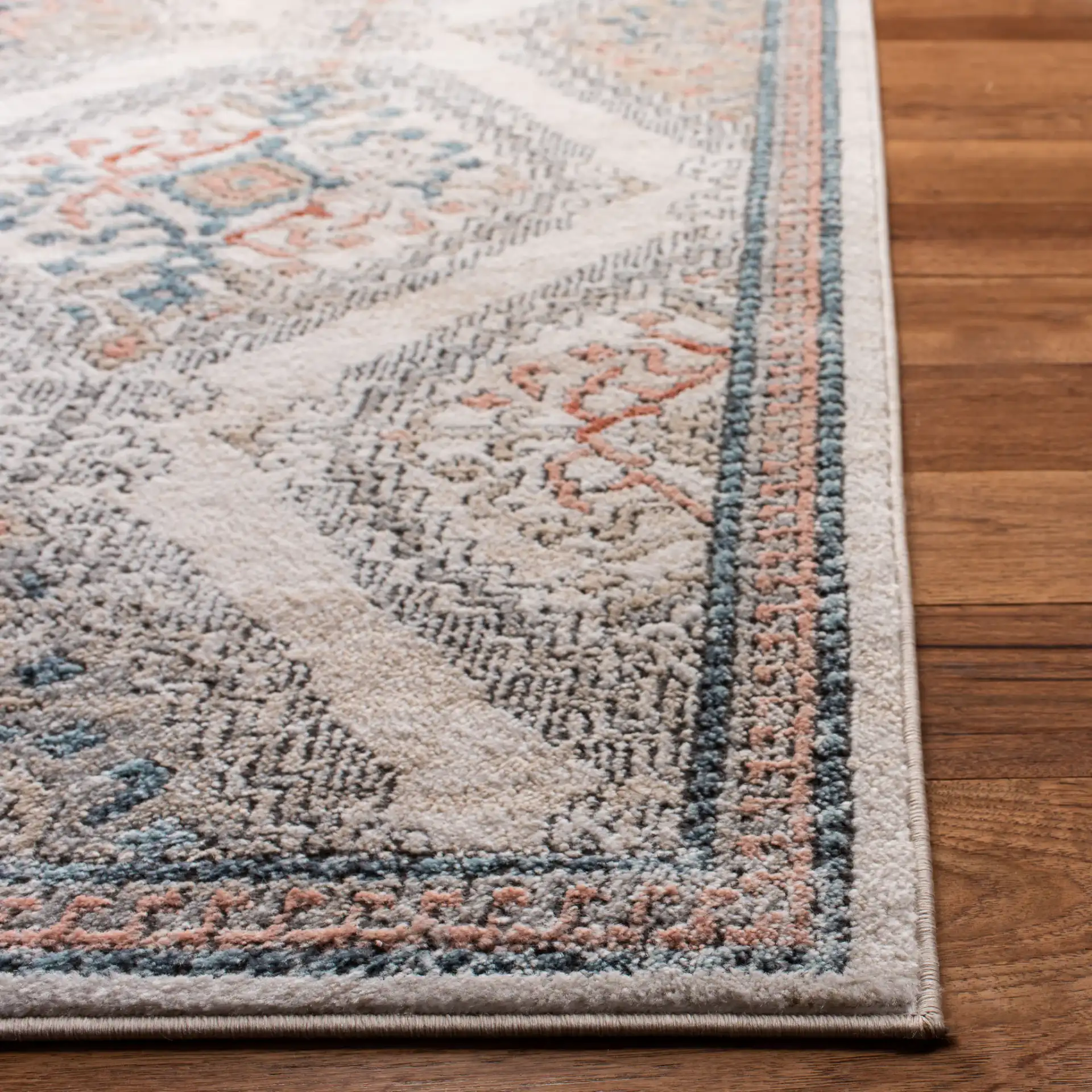 Oregon Tribal Diamond Rug in Gray / Ivory in a styled room