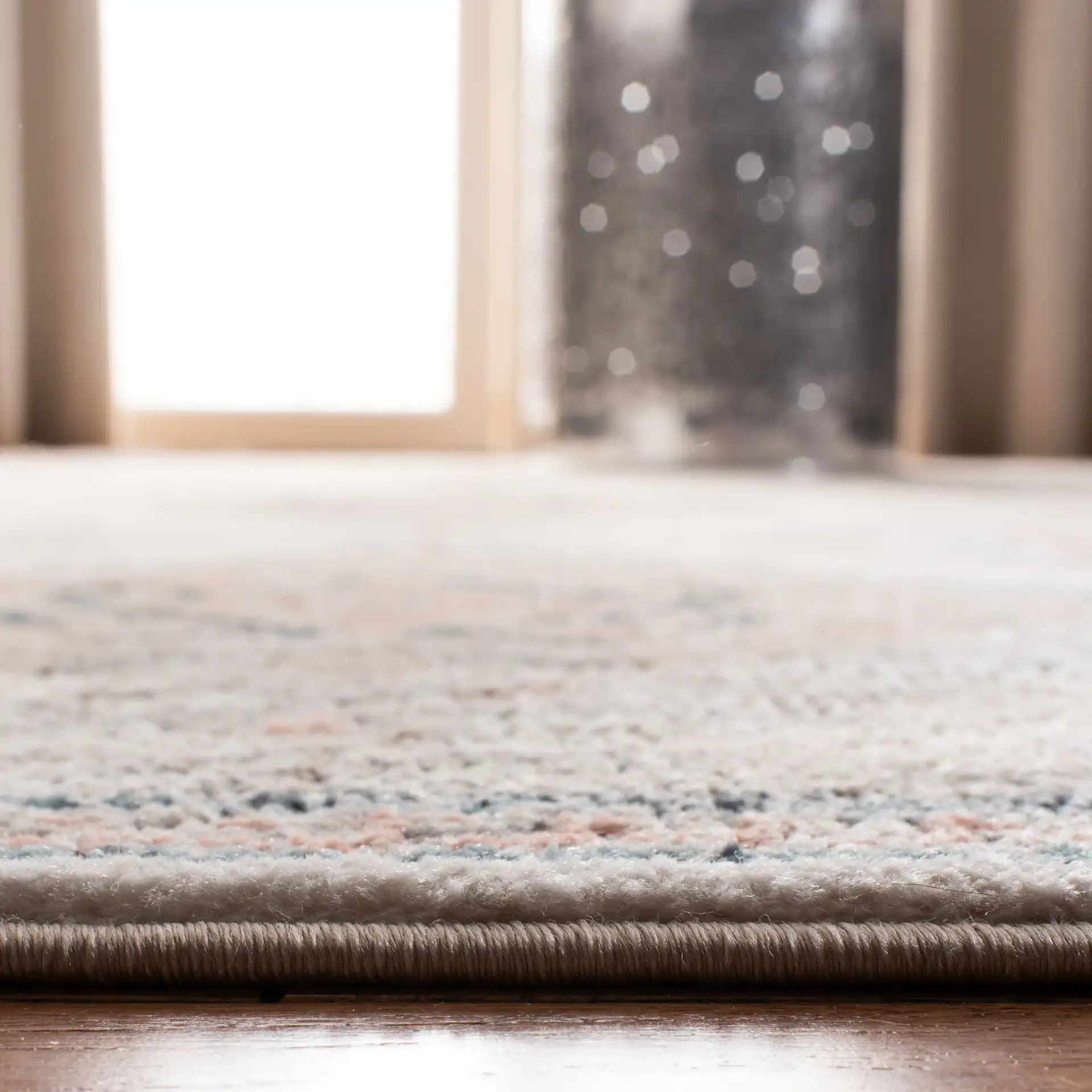 Oregon Tribal Diamond Rug in Gray / Ivory in a styled room