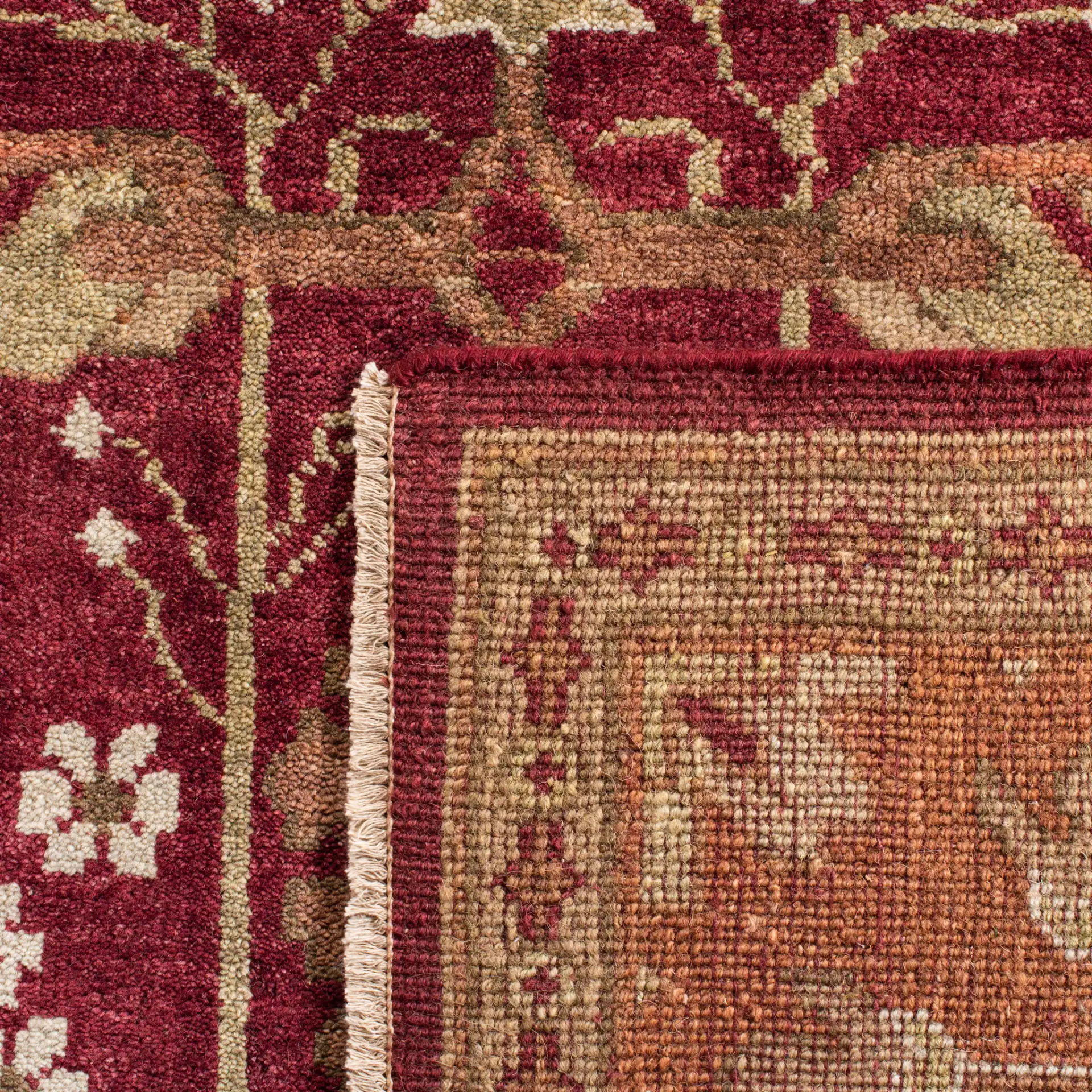 Oushak Symmetrical Floral Hand-Knotted Wool Rug in Red / Green in a styled room