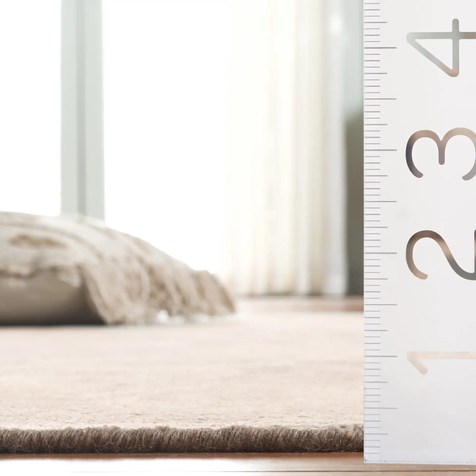 Oushak Faded Floral Bordered Hand-Knotted Wool Rug in Light Gray / Beige in a styled room
