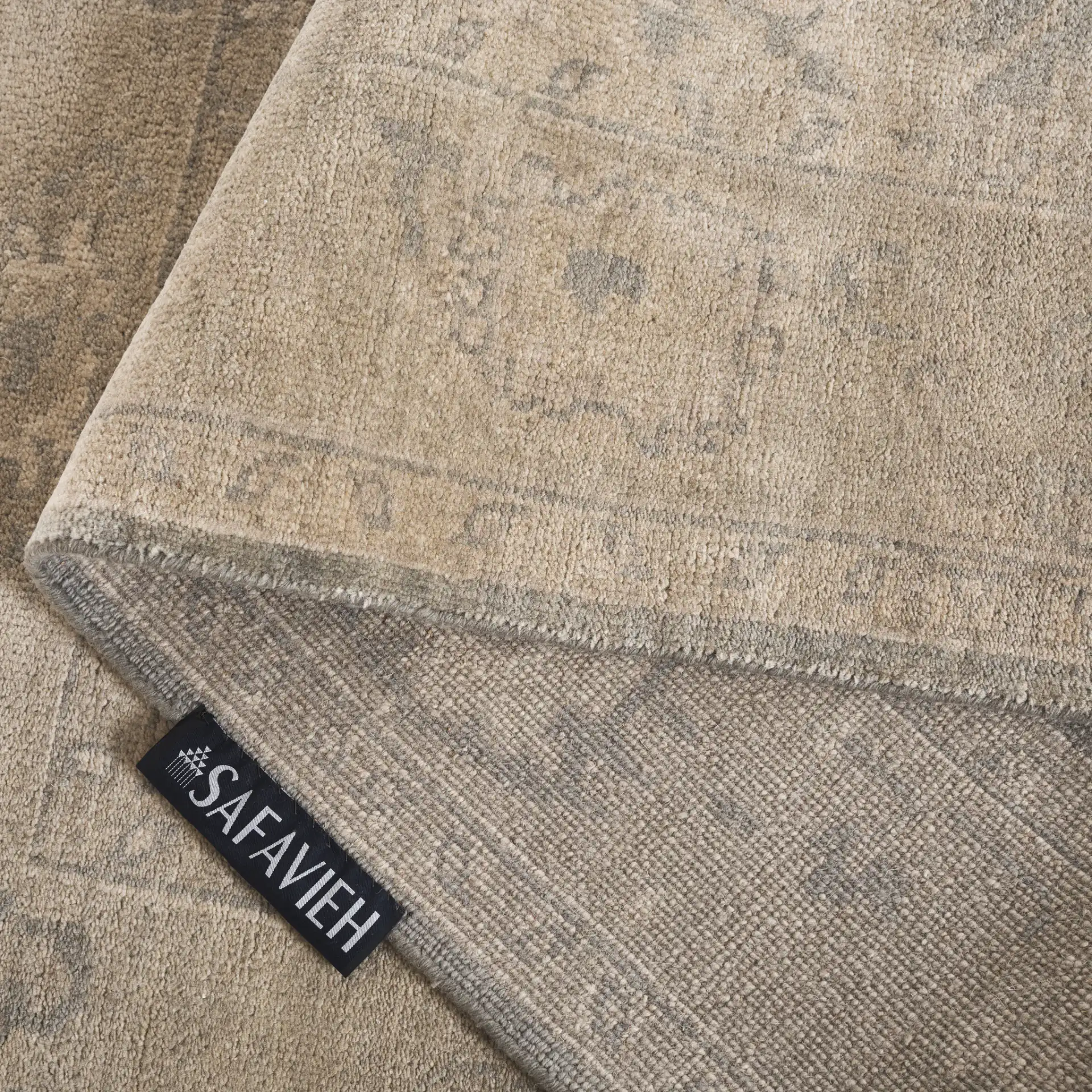 Oushak Faded Floral Bordered Hand-Knotted Wool Rug in Light Gray / Beige in a styled room