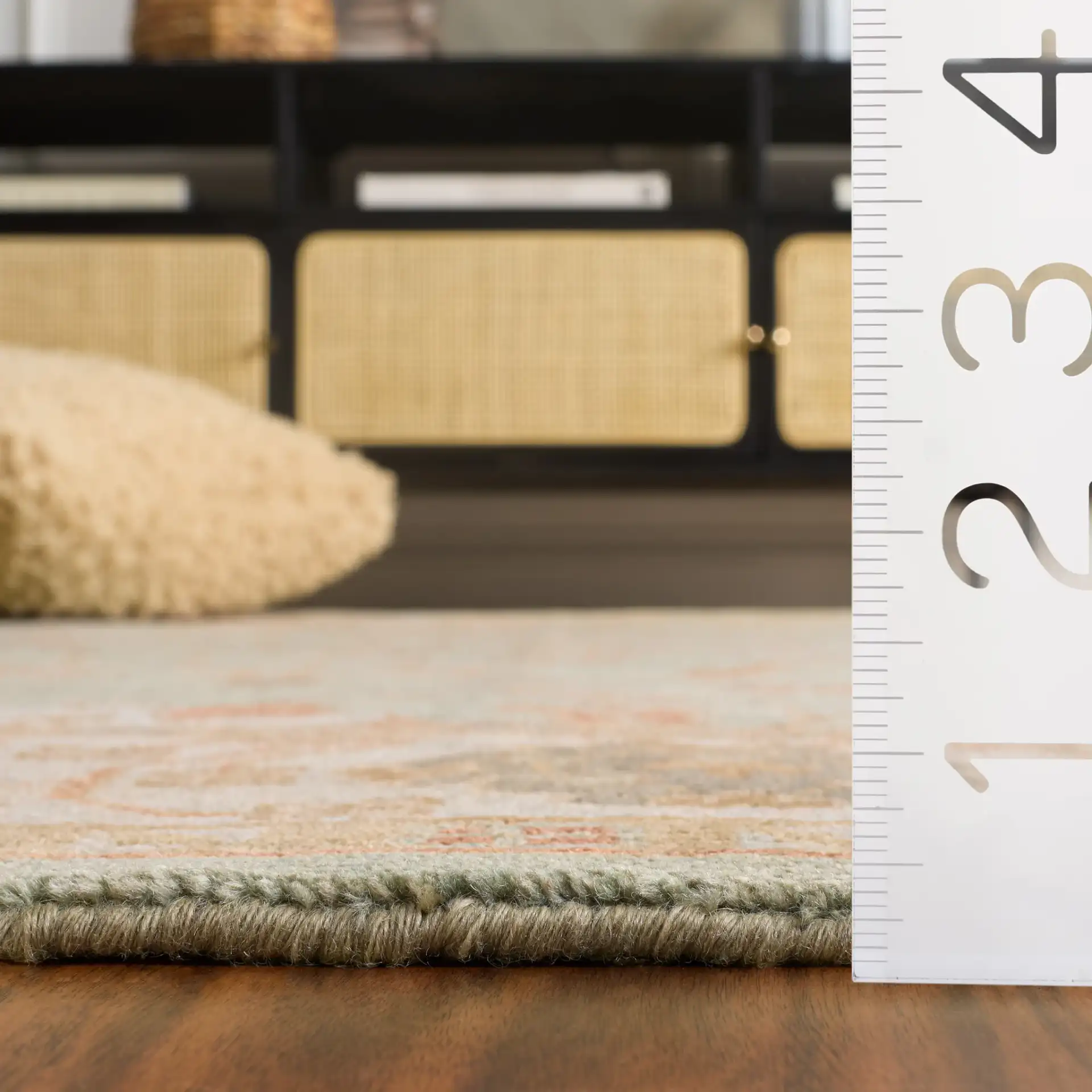 Oushak Faded Vine Hand-Knotted Wool Rug in Dark Green / Light Green in a styled room