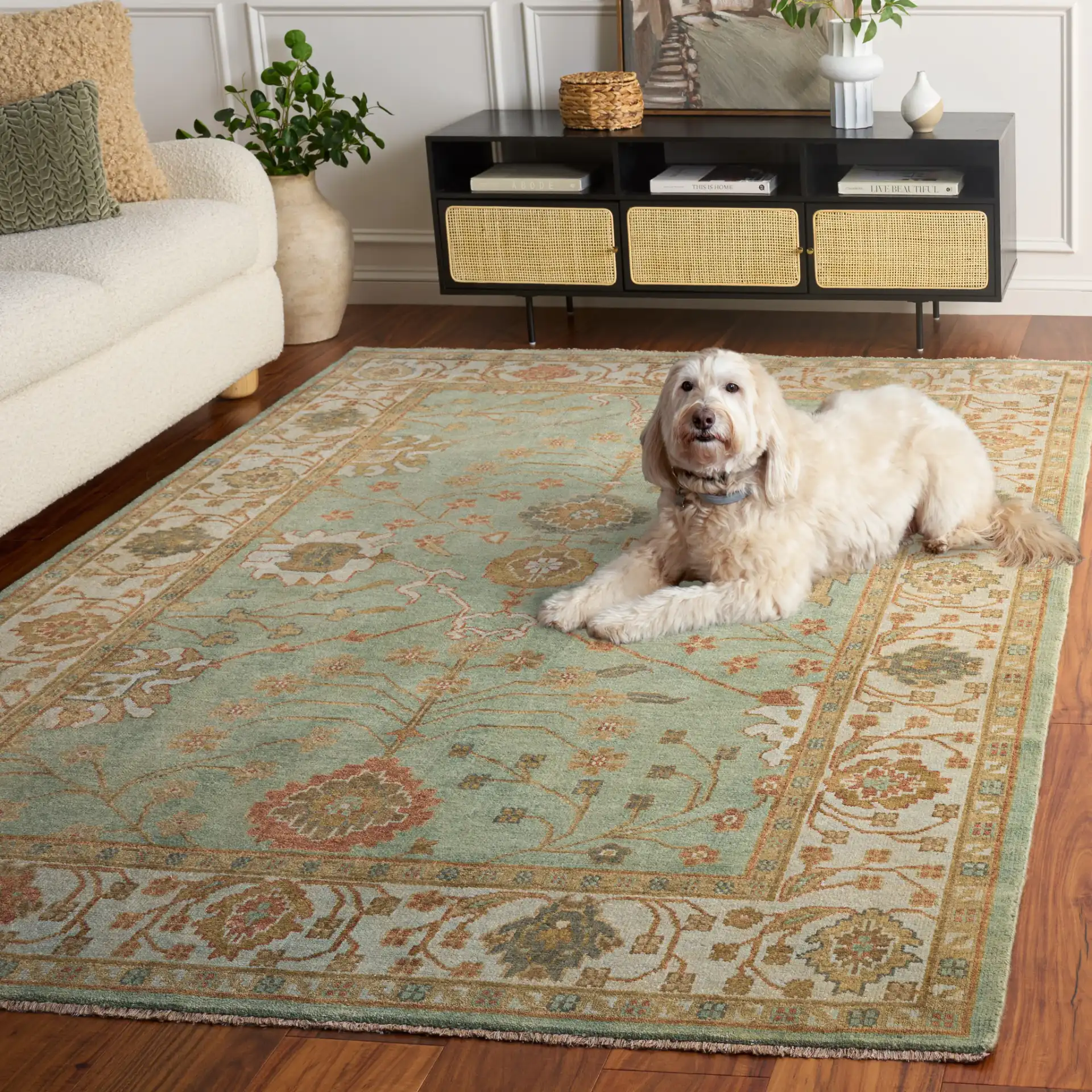 Oushak Faded Vine Hand-Knotted Wool Rug in Dark Green / Light Green in a styled room