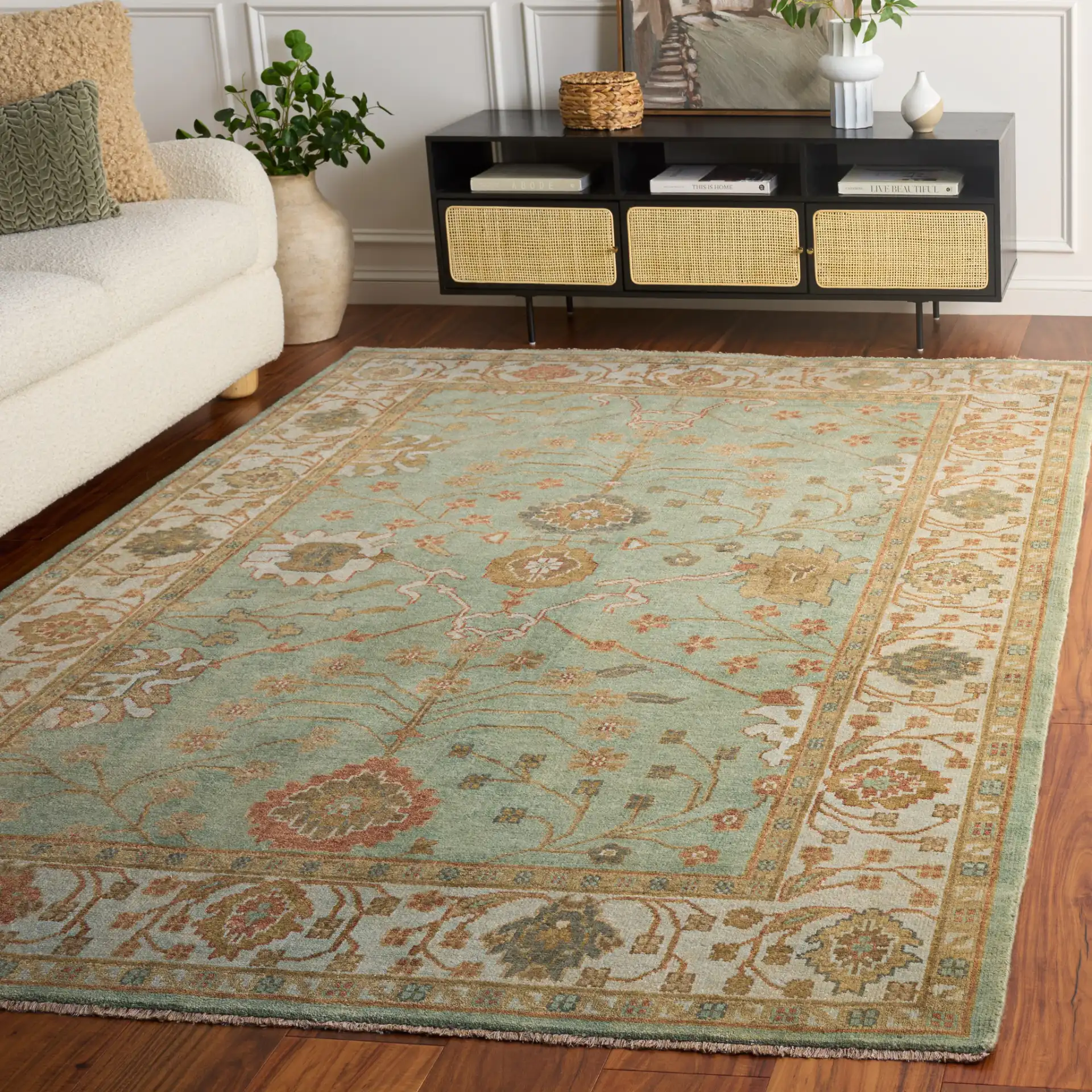 Oushak Faded Vine Hand-Knotted Wool Rug in Dark Green / Light Green in a styled room