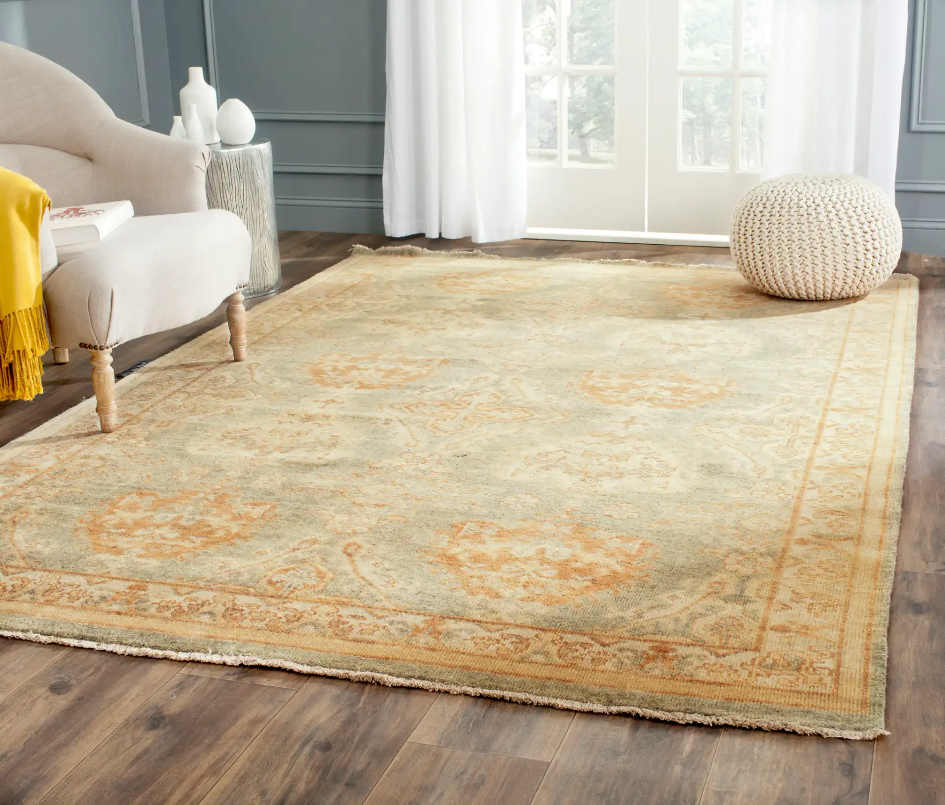 Oushak Palmette Trellis Hand-Knotted Wool Rug in Gray / Ivory in a styled room