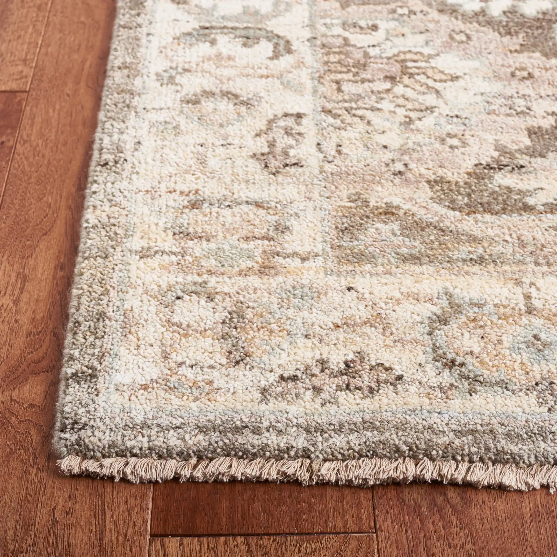 Oushak Allover Floral Vine Hand-Knotted Wool Rug in Gray / Ivory in a styled room