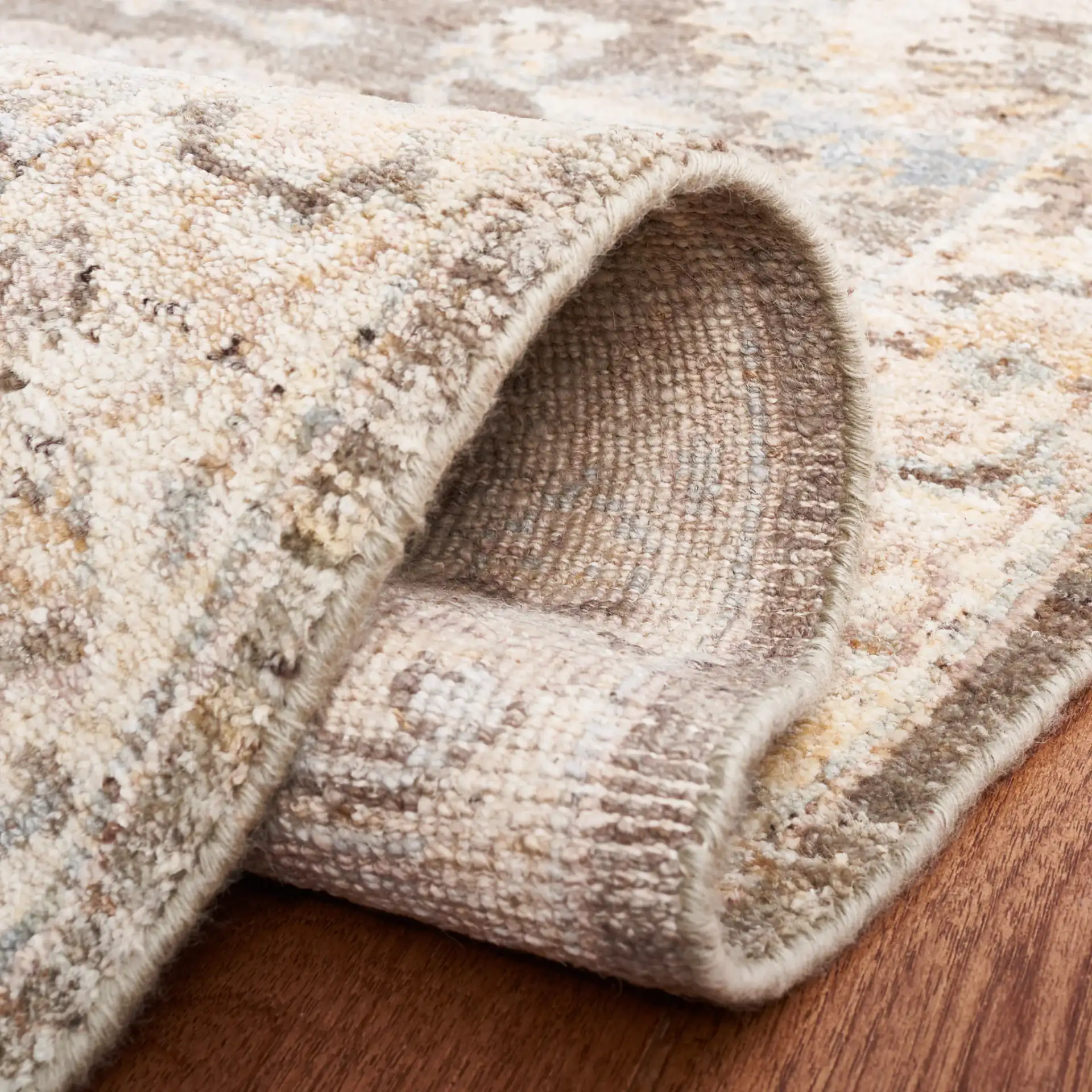 Oushak Allover Floral Vine Hand-Knotted Wool Rug in Gray / Ivory in a styled room