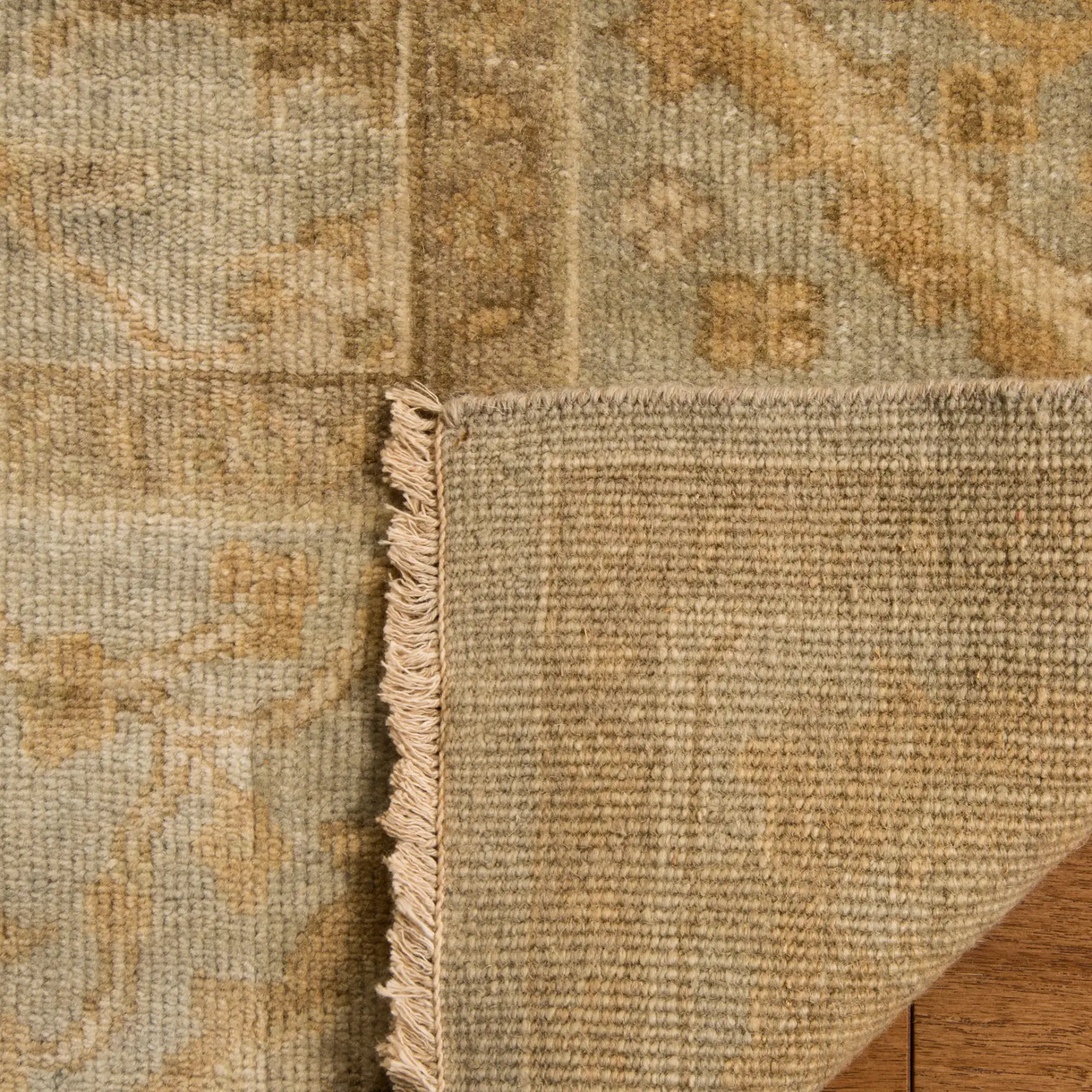Oushak Palmette Floral Hand-Knotted Wool Rug in Light Blue in a styled room