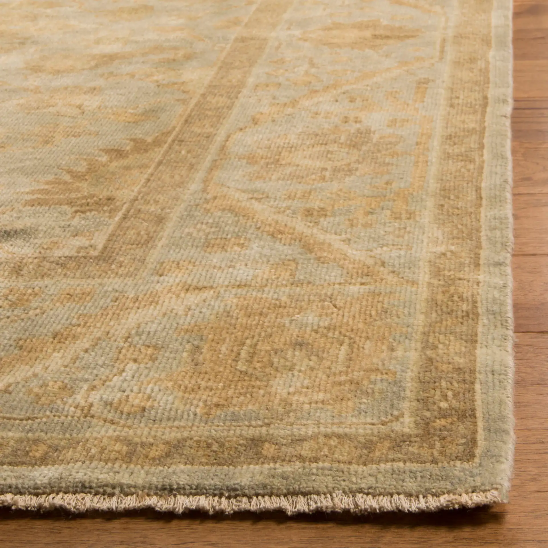 Oushak Palmette Floral Hand-Knotted Wool Rug in Light Blue in a styled room