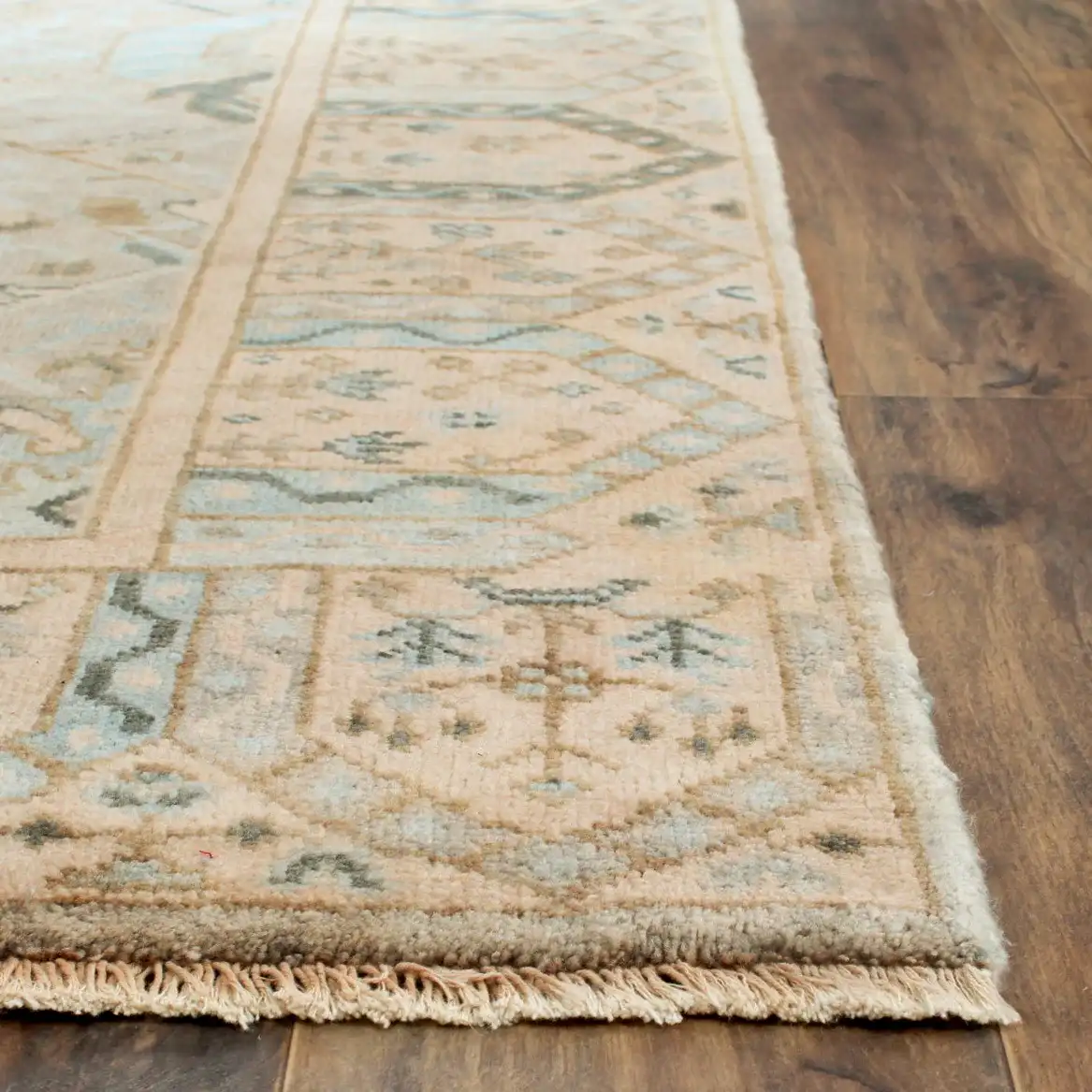 Oushak Diamond Lattice Hand-Knotted Wool Rug in Gray / Ivory in a styled room