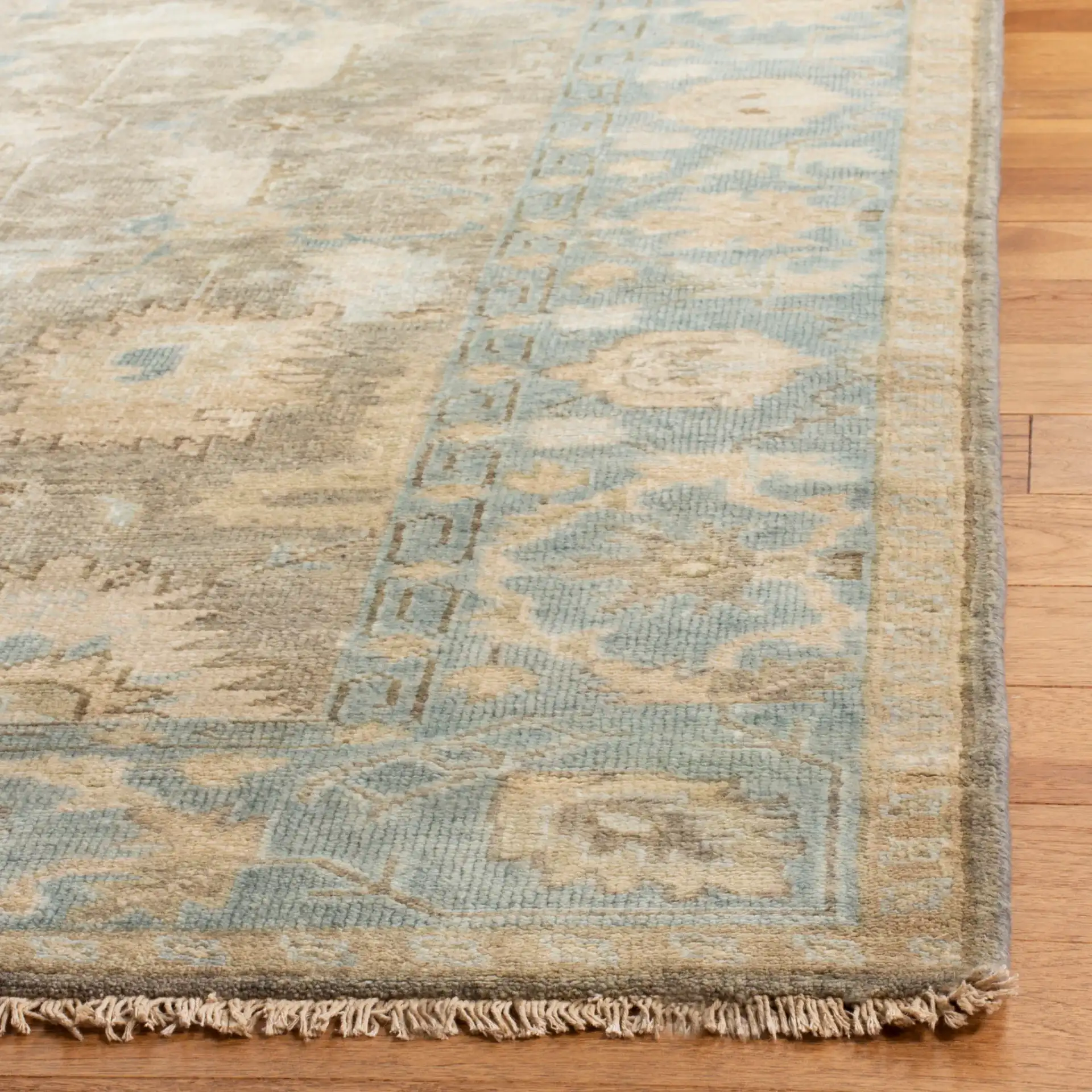 Oushak Tribal Floral Hand-Knotted Wool Rug in Brown / Blue in a styled room