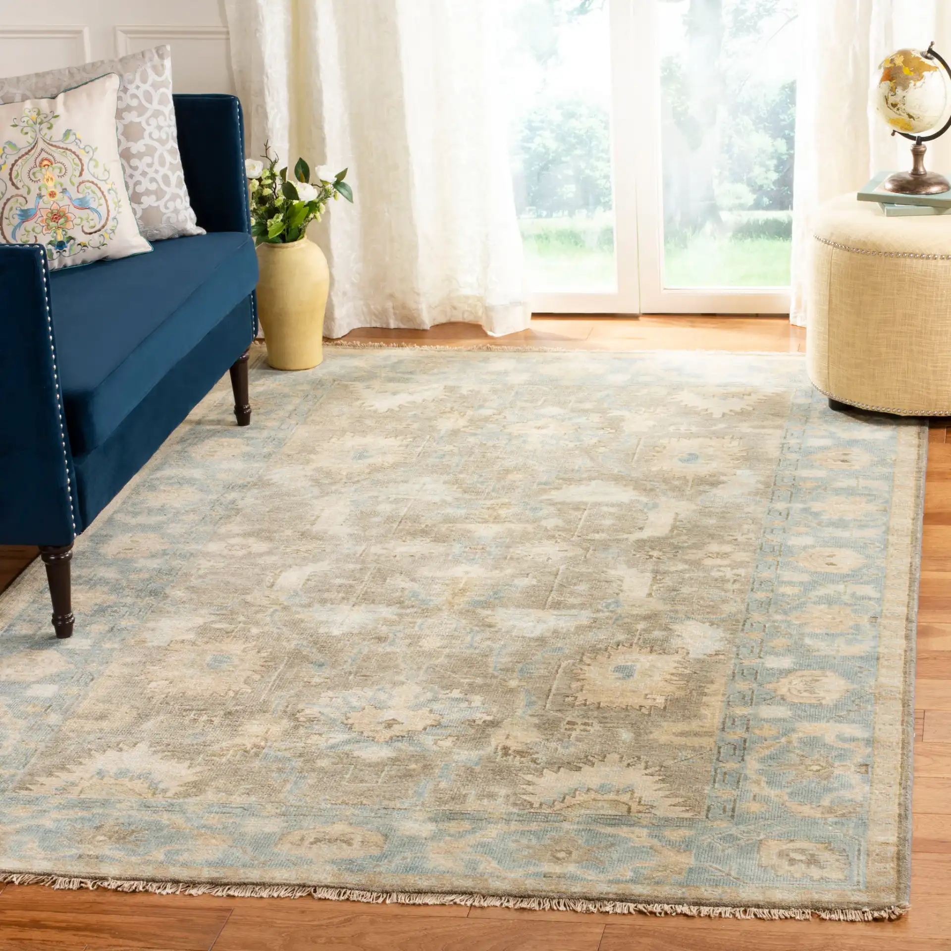Oushak Tribal Floral Hand-Knotted Wool Rug in Brown / Blue in a styled room