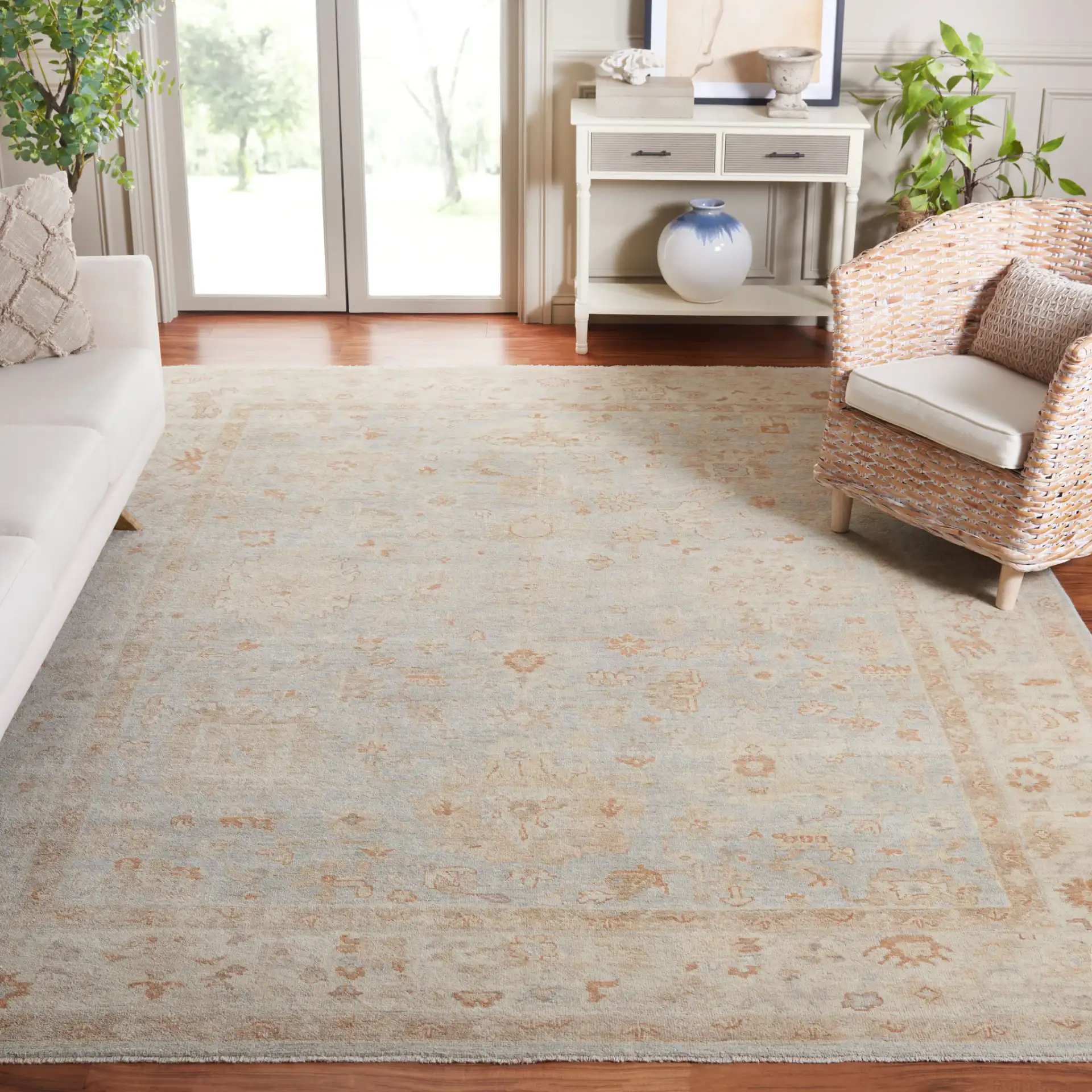 Oushak Allover Palmette Hand-Knotted Wool Rug in Light Blue / Beige in a styled room