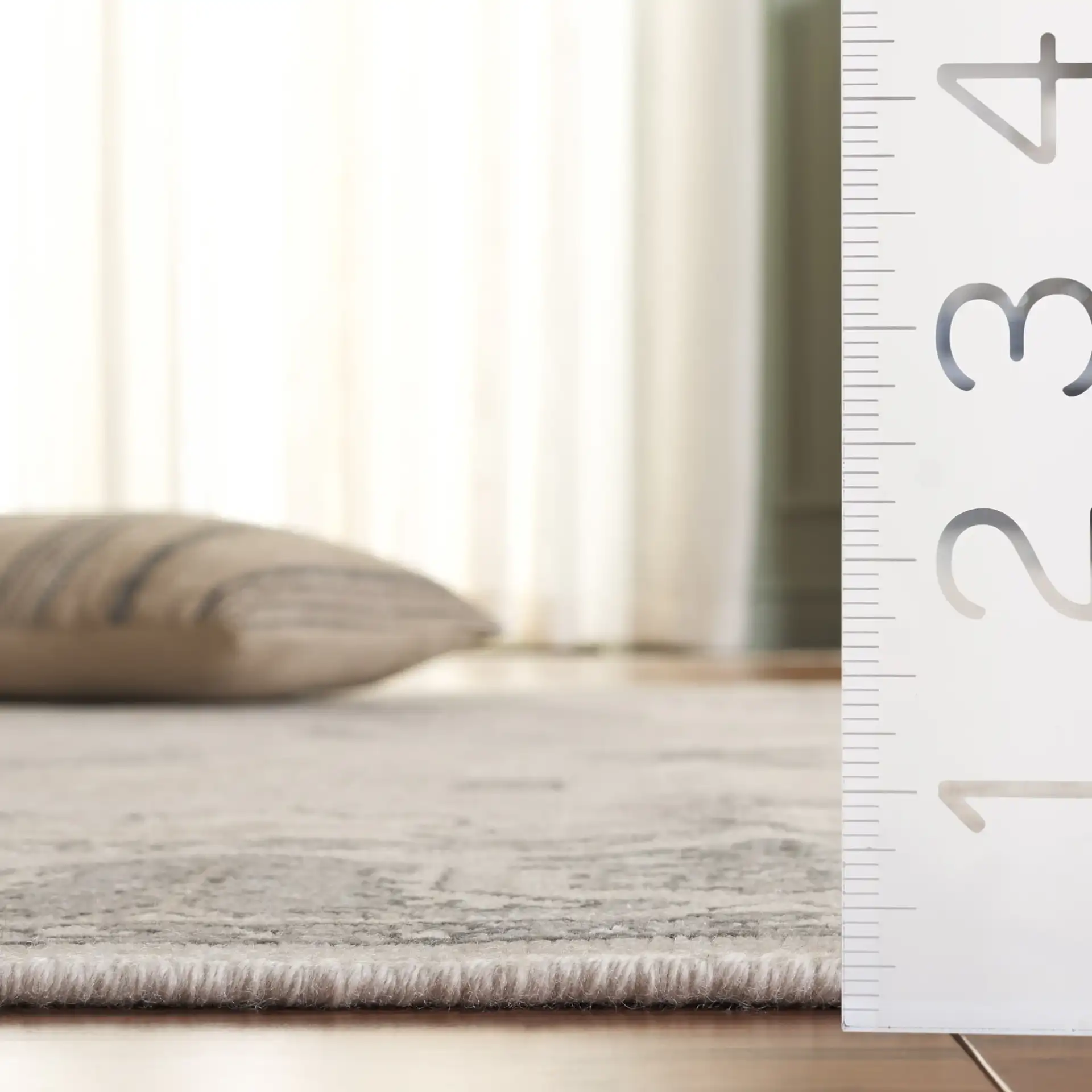 Oushak Scattered Floral Border Hand-Knotted Wool Rug in Silver / Gray in a styled room