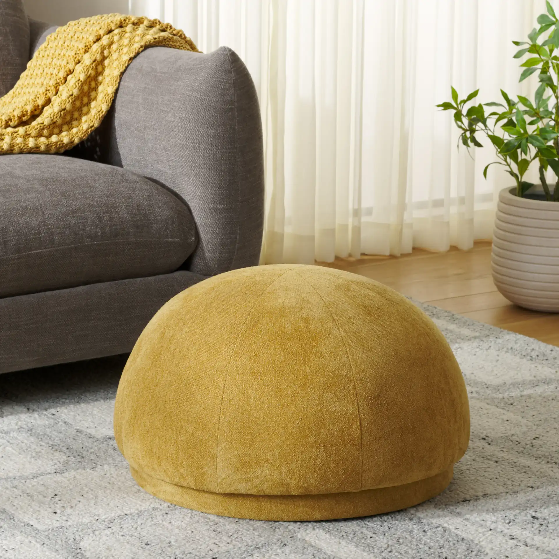 Lipy Half Sphere Ottoman in Mustard in a styled room