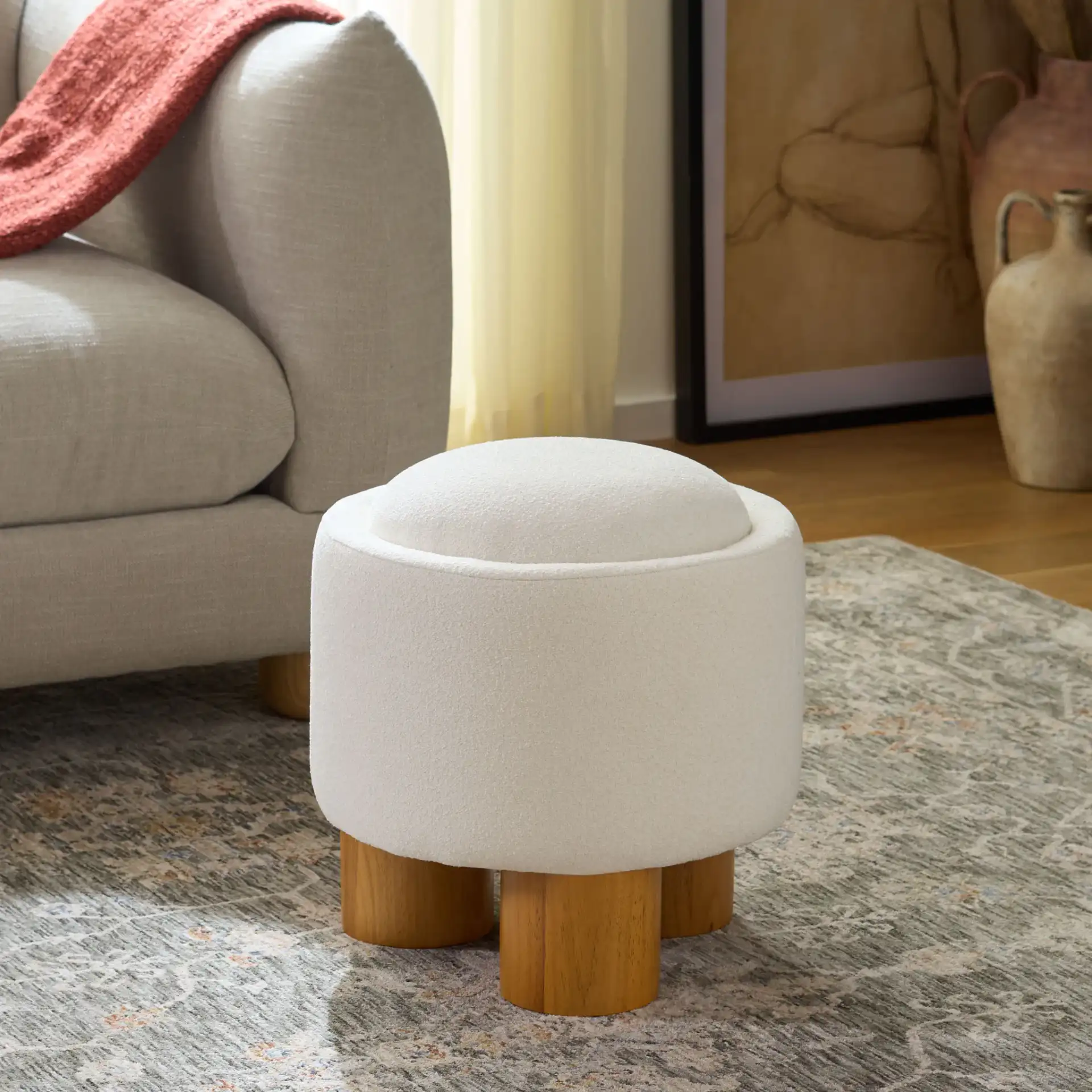 Posner Ottoman in Ivory / Natural in a styled room