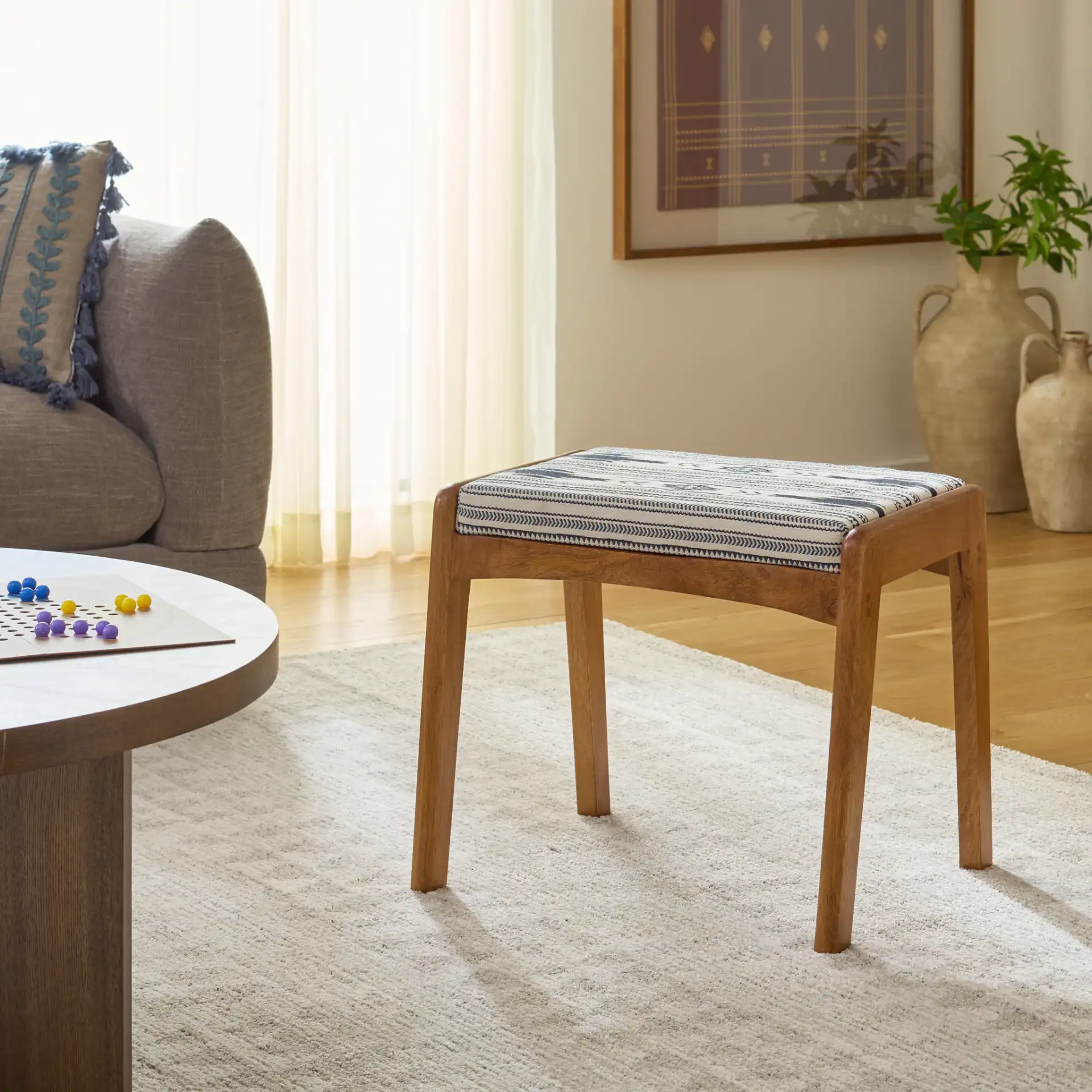 Ute Ottoman in Navy Blue White / Natural in a styled room